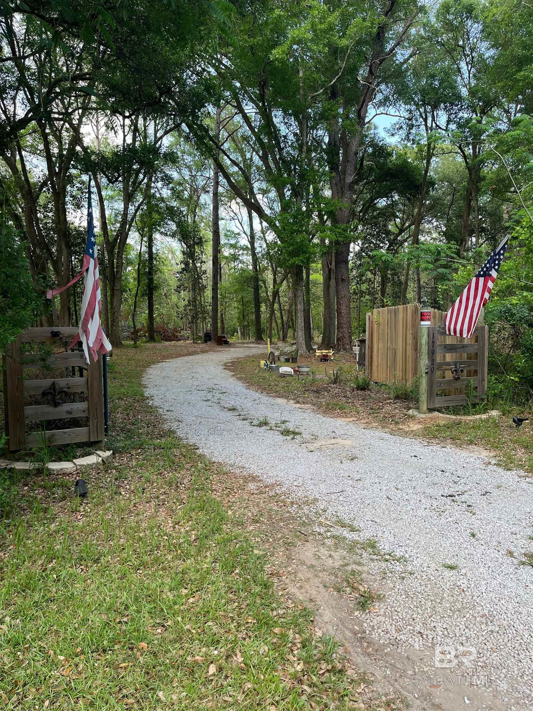 Nice parcel with almost 8 acres, on well and septic with power established and in a great location, very close to I-10 from either Hwy 59 or Beach Express, 5 minutes to Buc-ee's and less than 45 minutes to the beaches. Current zoning is agricultural with no HOA which offers many benefits and uses. Partially cleared homesite with multiple possibilities to develop here. Set up an appointment and come walk this property. Seller may convey the RV and older shed with acceptable offer, sale is subject to survey details and subdivision requirements. Buyer to verify information and necessary details during due diligence. Buyer to verify all information during due diligence.