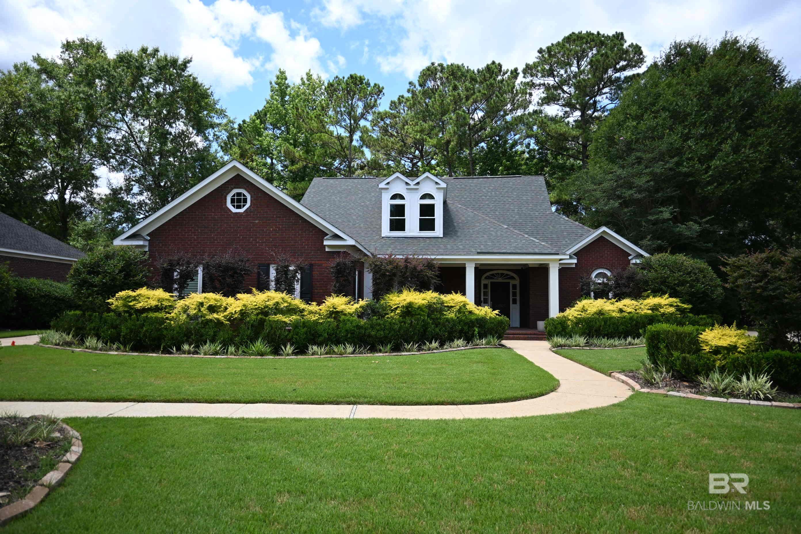 ***N E W   F O R T I F I E D   R O O F ***NEW PRICE***  Welcome to this stunning 5-bedroom, 4-bathroom home located on picturesque Timbercreek golf course, offering both comfort and luxury throughout.  This spacious 1-1/2 story home features a master suite conveniently located on the main floor, ensuring privacy and ease of access.  The open concept kitchen is a chef’s dream, complete with a charming keeping room and a bright breakfast room, perfect for enjoying morning meals while overlooking the beautifully landscaped yard.  The home boasts built-in bookcases, adding an elegant touch to the living spaces, and plantation blinds for both style and function.  Step outside and take in the serene views of the lush golf course, offering both tranquility and a sense of community.  The large yard is ideal for outdoor activities or simply relaxing while surrounded by mature trees and greenery.  Additional features include a partial home generator for peace of mind, a classic brick exterior, side entry garage with additional driveway parking, and meticulously maintained landscaping.  This home is the perfect combination of modern conveniences and timeless appeal, making it an ideal retreat for anyone looking to enjoy both luxury and the beauty of nature right from their own home! Buyer to verify all information during due diligence. Some photos are virtually staged.