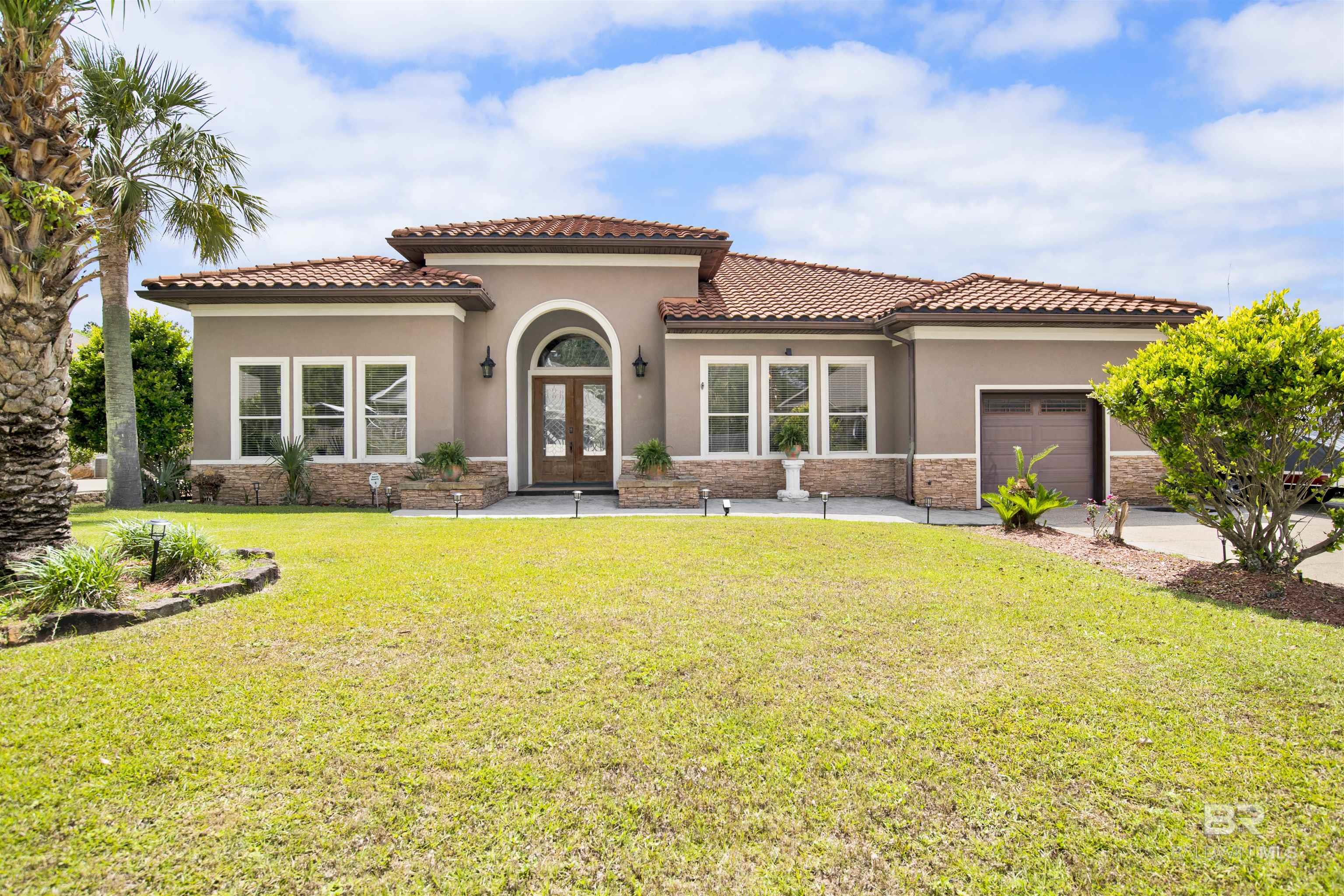 Back on the market at no fault of the seller.  This stunning Mediterranean-inspired home is sure to impress! Featuring 4 spacious bedrooms, 3 full baths, and an inground saltwater pool, it combines timeless elegance with thoughtful architectural details throughout.  The living area boasts soaring tray ceilings, custom built-ins, and a wet bar—perfect for entertaining. The chef’s kitchen offers granite countertops, stainless steel appliances, and a breakfast room with beautiful views of the pool. A formal dining room, anchored by a cozy corner gas fireplace, adds warmth and sophistication.  The primary suite is a luxurious retreat with tray ceilings, an en-suite bath featuring a soaking tub, separate shower, double vanities, and a large walk-in closet. An oversized two-car garage provides the extra space everyone needs.  Step outside to the veranda with an outdoor kitchen, creating an inviting outdoor oasis ideal for relaxing or hosting friends and family.  Don’t miss the opportunity to call this exceptional property your own! Buyer to verify all information during due diligence.