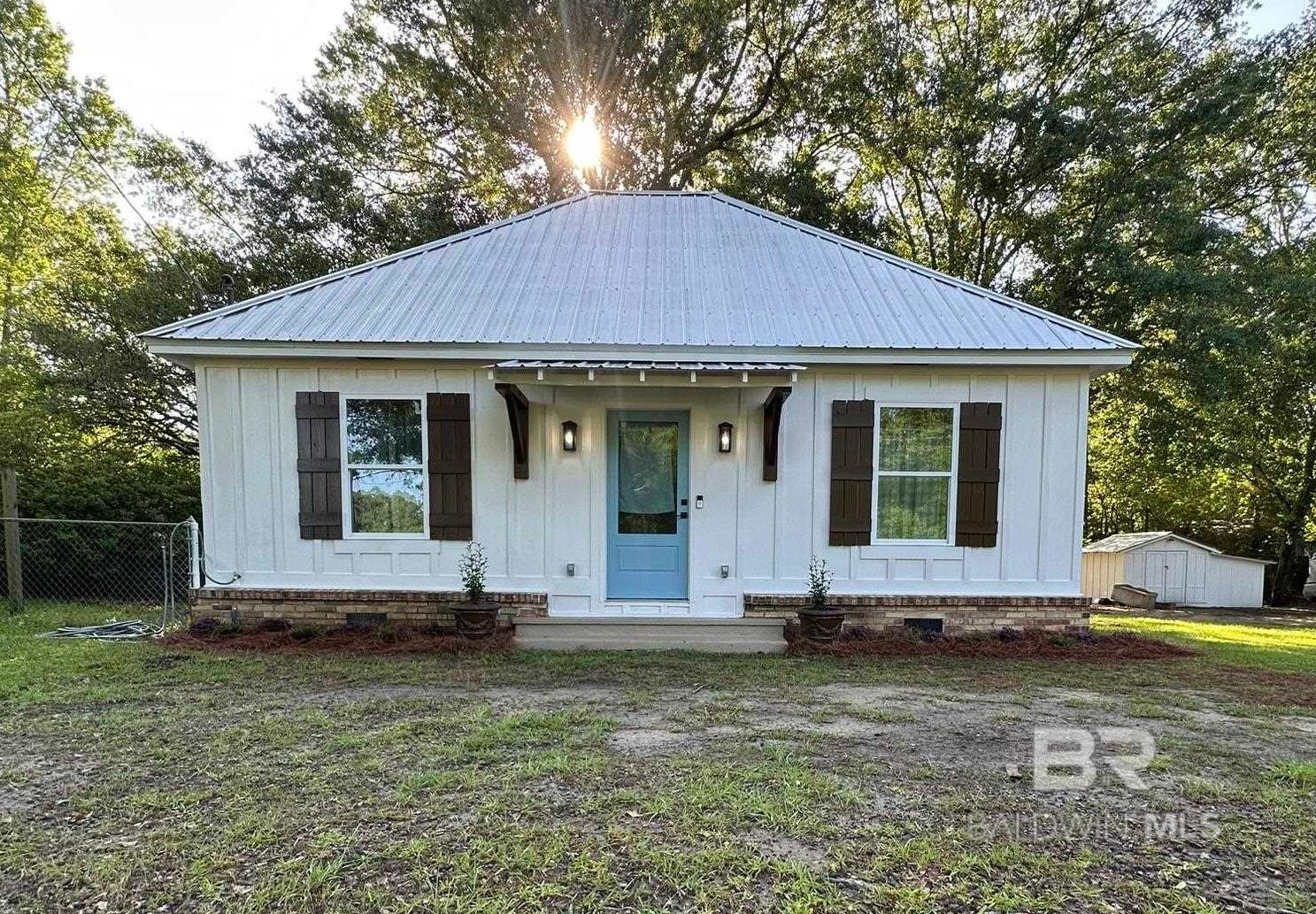 Welcome to this charming craftsman-style cottage on a quiet street just outside downtown Loxley. Set on a large, level lot with no HOA, this move-in-ready gem is full of thoughtful upgrades and Southern character. The home features a new metal roof added in 2022, new Hardie board siding from 2021, and a freshly repainted and caulked exterior in 2025. Inside, you'll find stunning real pine floors crafted from 1x12 planks, split brick in the entryway and bathroom, and a full electrical and plumbing update completed in 2021. The home also includes new subflooring, attic insulation, and a Ring doorbell for added convenience. Currently set up as a 1-bedroom, 1-bathroom home, the spacious extra room is being used as a large closet and laundry room—but with a separate laundry area located inside the oversized pantry, it could easily be converted into a second bedroom. Outdoors, the fenced backyard is perfect for pets and entertaining, complete with hot and cold water spigots near the back door—ideal for adding an outdoor shower. A storage shed with a new roof and siding in 2025, plus electrical and a window unit A/C, adds even more function and flexibility. Whether you're looking for a cozy primary residence, a weekend retreat, or a smart downsize, this centrally located property just off Hwy 59 offers quick access to I-10 and the sugar-white sands of the Alabama Gulf Coast. Professional photos will be posted no later than 5/13/2025. Buyer to verify all information during due diligence.