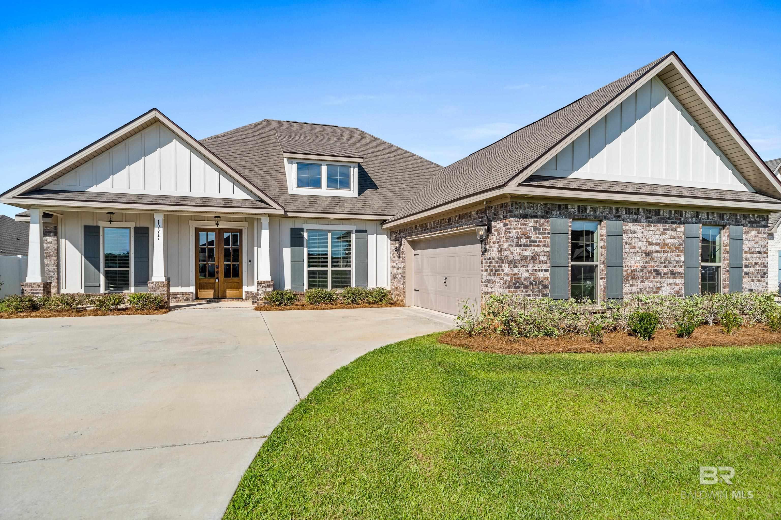 This newer Fortified Constructed Truland Built Home is the perfect combination of features, quality, value and a great layout located in Jubilee Farms in Daphne Al.  The open concept has a big living room area that flows into the rest of the home but also includes a separate dining room, a beautiful morning room area and large bedrooms all on a big lot.  The living room area has hardwood flooring, upgraded molding, loads of windows allowing for natural light to fill the space and a gas fireplace.  Separating the living room and kitchen is a large bar with quartz countertops.  The kitchen is well appointed and includes Stainless appliances, a Gas range, custom painted cabinets, a large farm sink, a disposal, microwave and upgraded faucets.  There are loads of cabinets and a large pantry for storage.  The 4 bed 3 bath home has 3 bedrooms downstairs with 3 bathrooms and an additional bedroom/bonus room upstairs with another full bath.  The primary bedroom has hardwood floors, big walk-in closet and an attached bath.  The primary bath includes a private toilet area, double sinks, granite countertops, a big shower and separate tub. The entire home has LED lighting, dual zoned heating and cooling, blinds on all the windows, and ceiling fans installed for convince.  Outside is a large, covered porch with an attached patio.  The flat and level yard is large enough to accommodate a pool or for pets.  As a big bonus it's entirely fenced. The neighborhood has incredible features to enjoy as well.  They include sidewalks, multiple ponds and water features that are well stocked with fish.  There is an incredible pool with water slides a big club house and an attached park to play in and have neighborhood football/soccer games. Buyer to verify all information during due diligence.