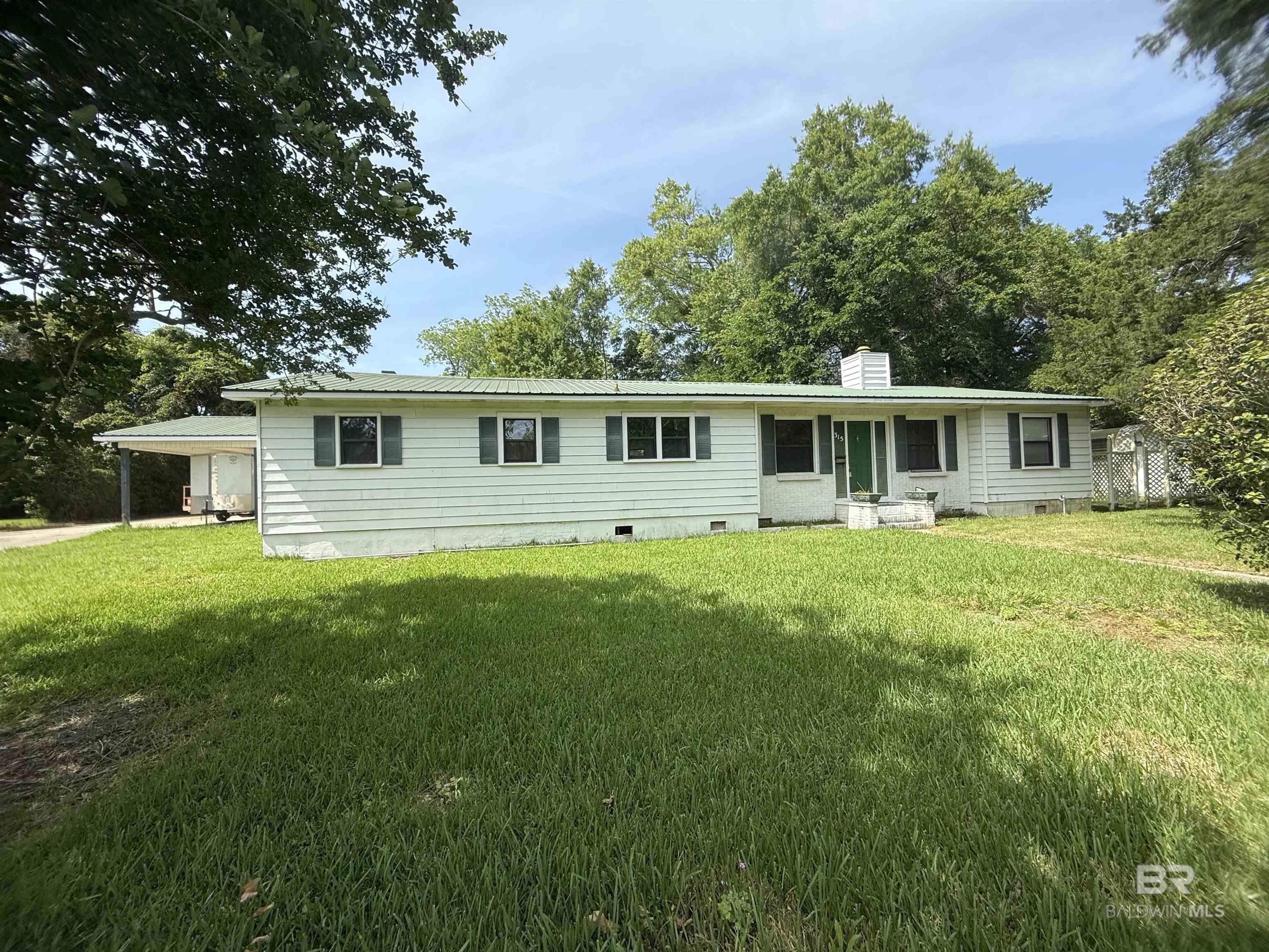 Partially Gutted Fixer upper with plans to expand and remodel! It's just a short stroll or golf cart ride from vibrant downtown Fairhope! Bring your vision to life in this partially gutted 3-bedroom, 2-bath home with a dedicated office, located just a short stroll or golf cart ride from vibrant downtown! With 2,500 sq ft currently in place and plans provided to expand to a 3/3 3,000 sq ft, this property is your opportunity to create a truly custom space in one of the most desirable neighborhoods around. Retain character with features like a wood-burning fireplace and metal roof, while finishing the renovation to match your dream aesthetic. Whether you're an investor or an inspired homeowner, this blank-slate opportunity is packed with potential. Property Highlights include: Partially gutted – construction head start, Plans included for a 3 bed, 3 bath + office layout (3,000 sq ft) the additional 500 square feet is already covered where the porch is now. Existing 2,500 sq ft structure with room to grow. Two wood-burning fireplaces & long-lasting metal roof. Detached double garage with a Prime location close to all downtown shopping and restaurants. Span extra room perfect for an office or man cave, Spacious lot with no HOA. Endless design possibilities Sold As-Is. Finish what’s been started and make it your own masterpiece! Buyer to verify all information during due diligence.