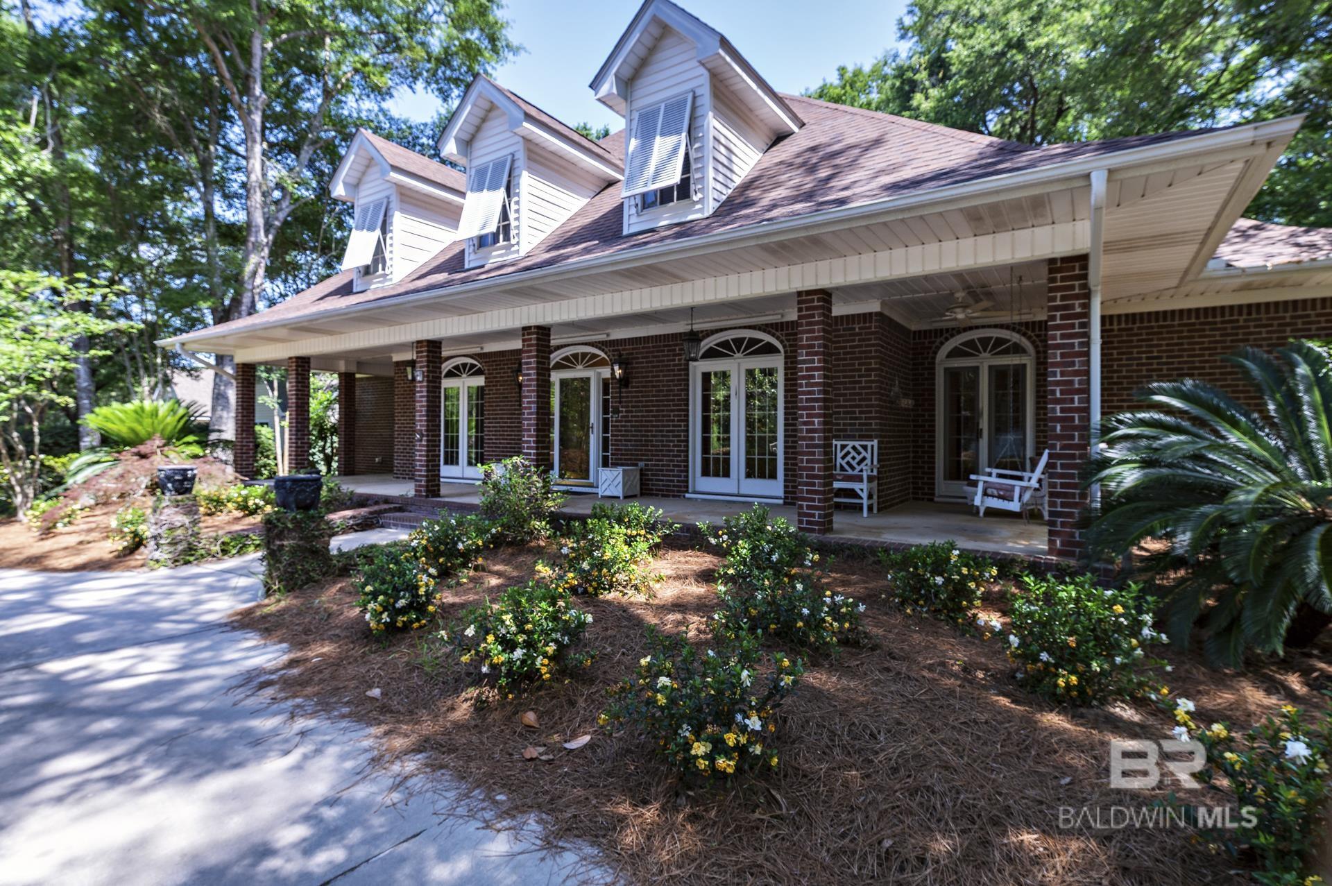 Expansive Custom Home with Exceptional Potential – Located in the coveted Oak Bluff Estates subdivision within the highly sought-after Olde Towne Daphne area, this spacious 4-bedroom, 3.5-bath home offers over 3,500 square feet of well-designed living space. The thoughtful floor plan features a main-level primary suite, with three additional bedrooms upstairs, providing comfort and flexibility for families of all sizes.Enjoy a variety of living spaces including a formal dining room, cozy den with fireplace, sunroom, and a formal sitting room—ideal as a home office or reading retreat. Notable updates include a new roof (2020), main-level water heater (2022), updated HVAC systems (2023), Upstairs water heater (2025) and a whole-house generator installed in 2024. Situated on a beautifully landscaped 17,600 sq ft lot, the property also features a private, fenced backyard and a rear patio perfect for outdoor entertaining.This home is being sold as-is, but has been well maintained with key improvements already completed, offering excellent value and a rare opportunity to add your personal finishing touches. Located close to top-rated schools, shopping, and the scenic shores of Mobile Bay, this home blends space, location, and potential like no other.Don’t miss your chance to own a custom home in one of Daphne’s most desirable neighborhoods! Buyer to verify all information during due diligence.