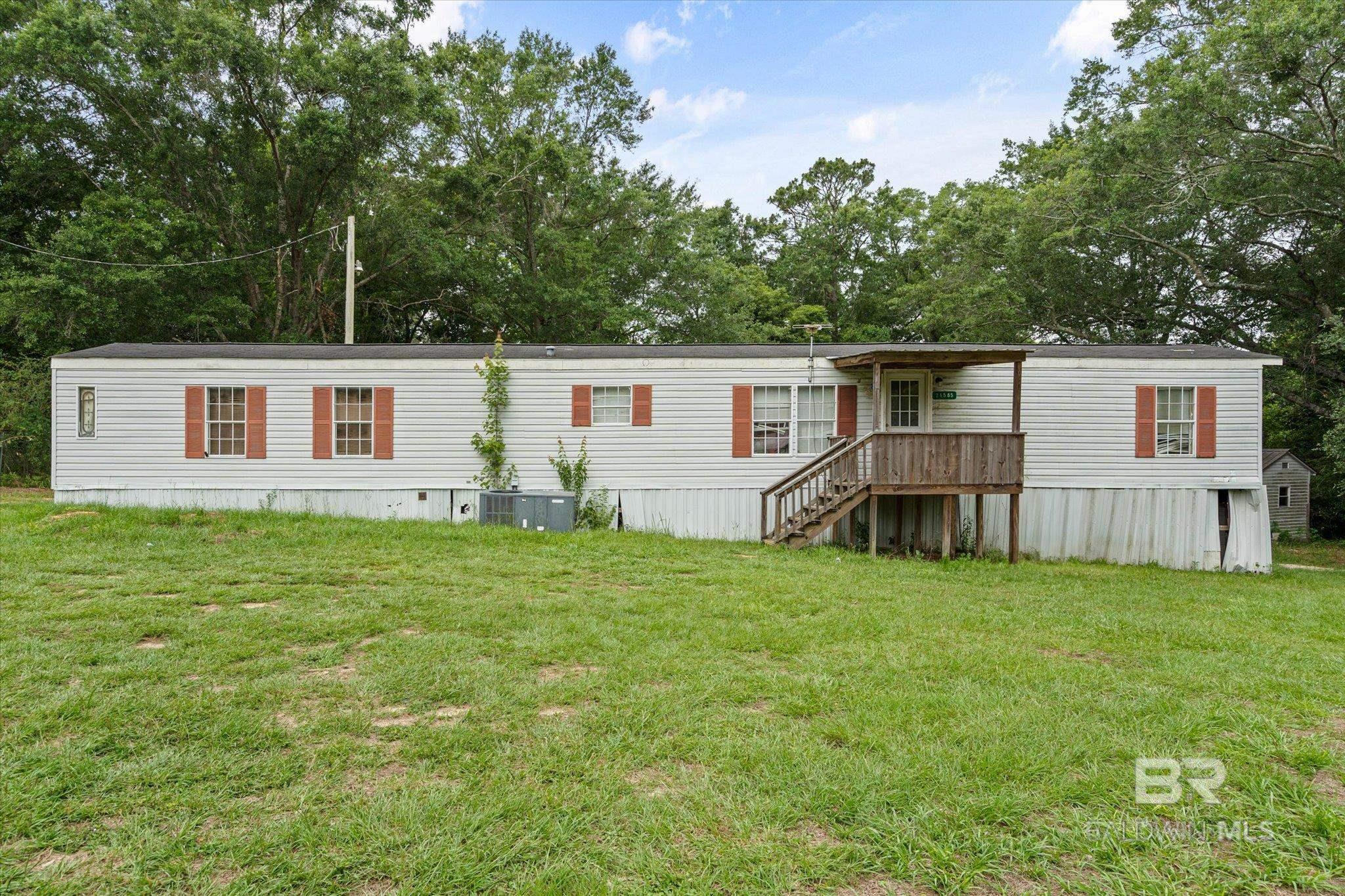 This is a 2 bed, 2 bath mobile home on .66 acres in a quiet area of Robertsdale. This property offers a great opportunity for buyers looking to put their own touch on a home with land. The HVAC was replaced in 2017 and has been well cared for. A home warranty is included for added peace of mind. Seller is open to concessions with a strong offer. Plenty of potential here, schedule your showing today! All information is either estimated or obtained from tax records and must be verified by buyer or buyer agent. Buyer to verify all information during due diligence.