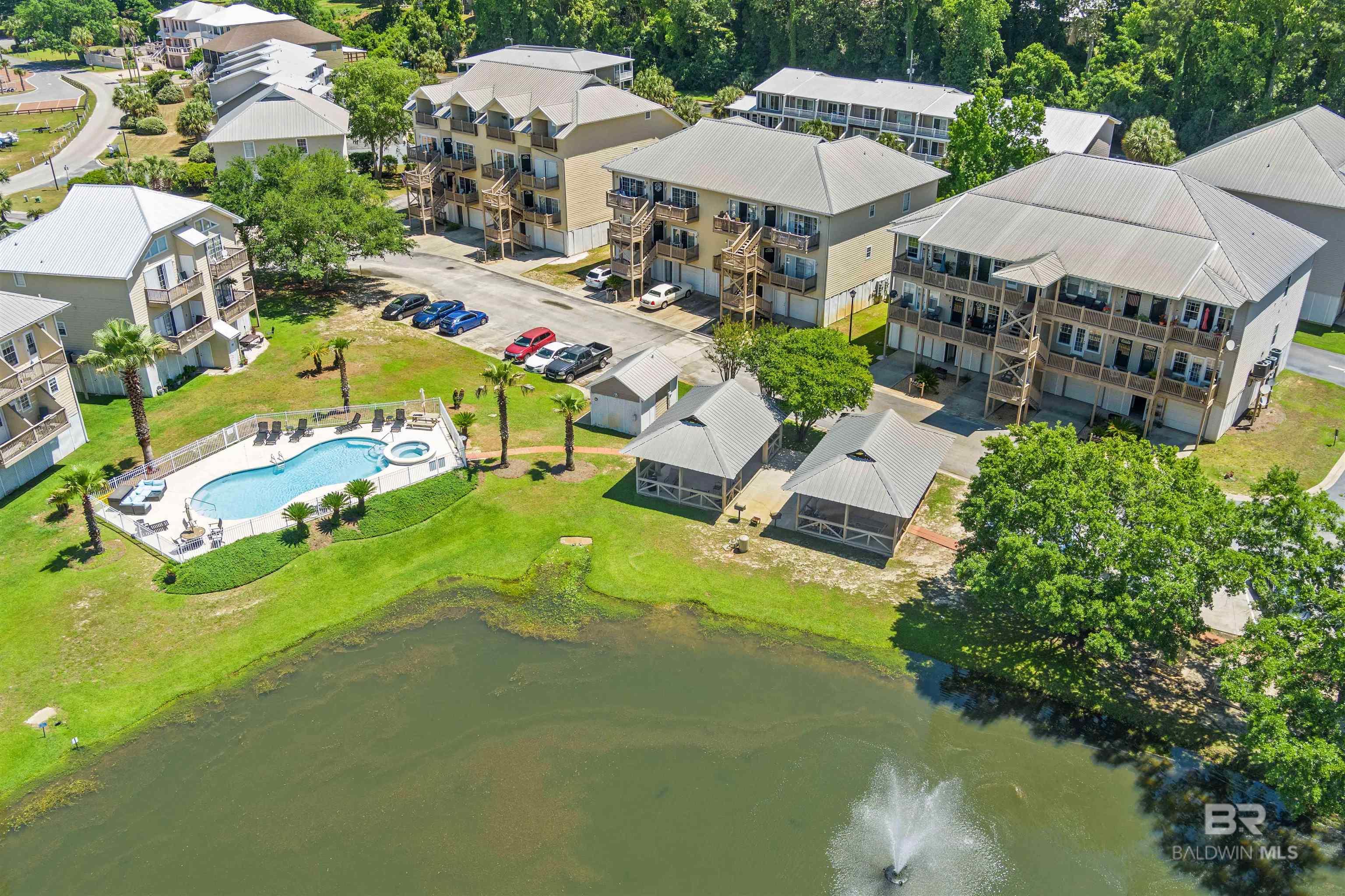 **Value Range Marketing: Seller is entertaining offers from $199,000 - $217,000. The lower value range and the upper value range equals the list price** Enjoy low-maintenance, coastal living in this beautifully maintained 2 bed, 2 bath condo located in the sought-after Sunset Bay Villas. This one-level unit features an open floor plan with great flow from the living room to the kitchen and dining area. Enjoy your morning coffee on the front deck, accessible directly from the living space. Highlights include private elevator access, a sealed single-car garage located near the elevator, and all appliances conveying — including washer and dryer. The community offers fantastic amenities: a sparkling pool, stocked pond, grilling pavilion, and a private fishing pier. Located just minutes from I-10, the new public boat launch, and the popular Waterfront Restaurant on Mobile Bay. You’re also a short drive to Olde Towne Daphne, downtown Fairhope, and the white-sand beaches of Gulf Shores. HOA covers: hurricane insurance, termite bond, exterior maintenance, pool, pier, and elevator upkeep. BONUS: With a reasonable offer, seller is open to including closing costs, a 1-year home warranty, and some furniture. Minimum 6-month rental restriction. Buyer to verify all information during due diligence.