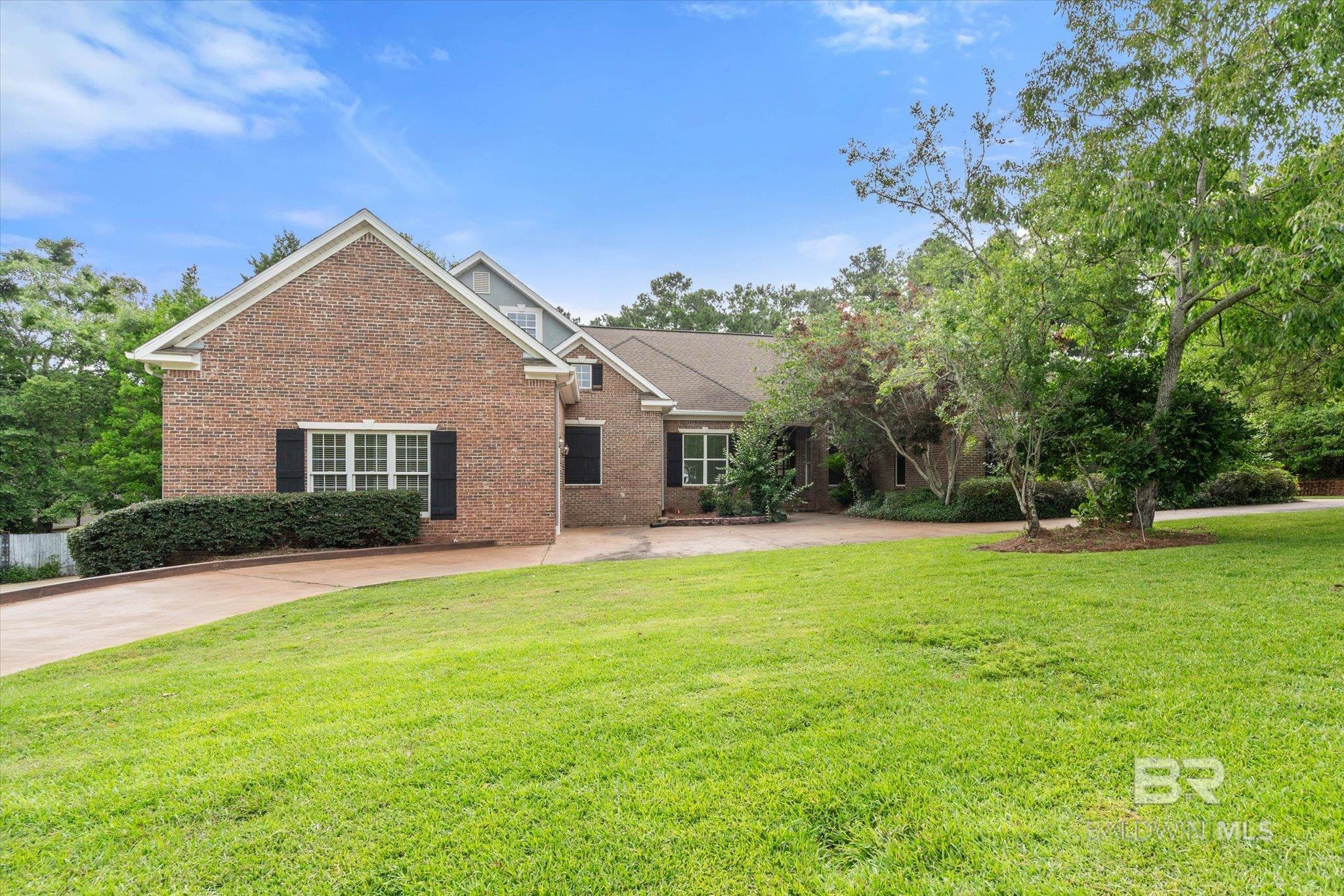 Built in 1995, this well-maintained residence offers generous space, thoughtful features, and a layout designed for both comfort and function. The main level welcomes you with a formal dining room, formal living room, and a spacious family room — all enhanced by 10-foot ceilings and elegant crown molding.Two large bedroom suites are located on the main level. One includes a private workout room with a hot tub and two walk-in closets, offering added versatility and privacy. The kitchen features a breakfast bar and two pantries, providing excellent storage and convenience.The finished basement expands the living area with a game room, media room, and a storm shelter constructed entirely of concrete for engineered safety and peace of mind.Outdoor amenities include a pool with a 2-year-old liner, a newly installed pump well for pool and irrigation systems, and a convenient half bath located near the pool area. Additional updates include an 8-year-old roof and a whole-house generator for added reliability.This home offers flexible living options, extensive storage, and inviting spaces both inside and out — ready to meet a wide variety of needs and lifestyles.Buyer to verify all information during due diligence. Buyer to verify all information during due diligence.
