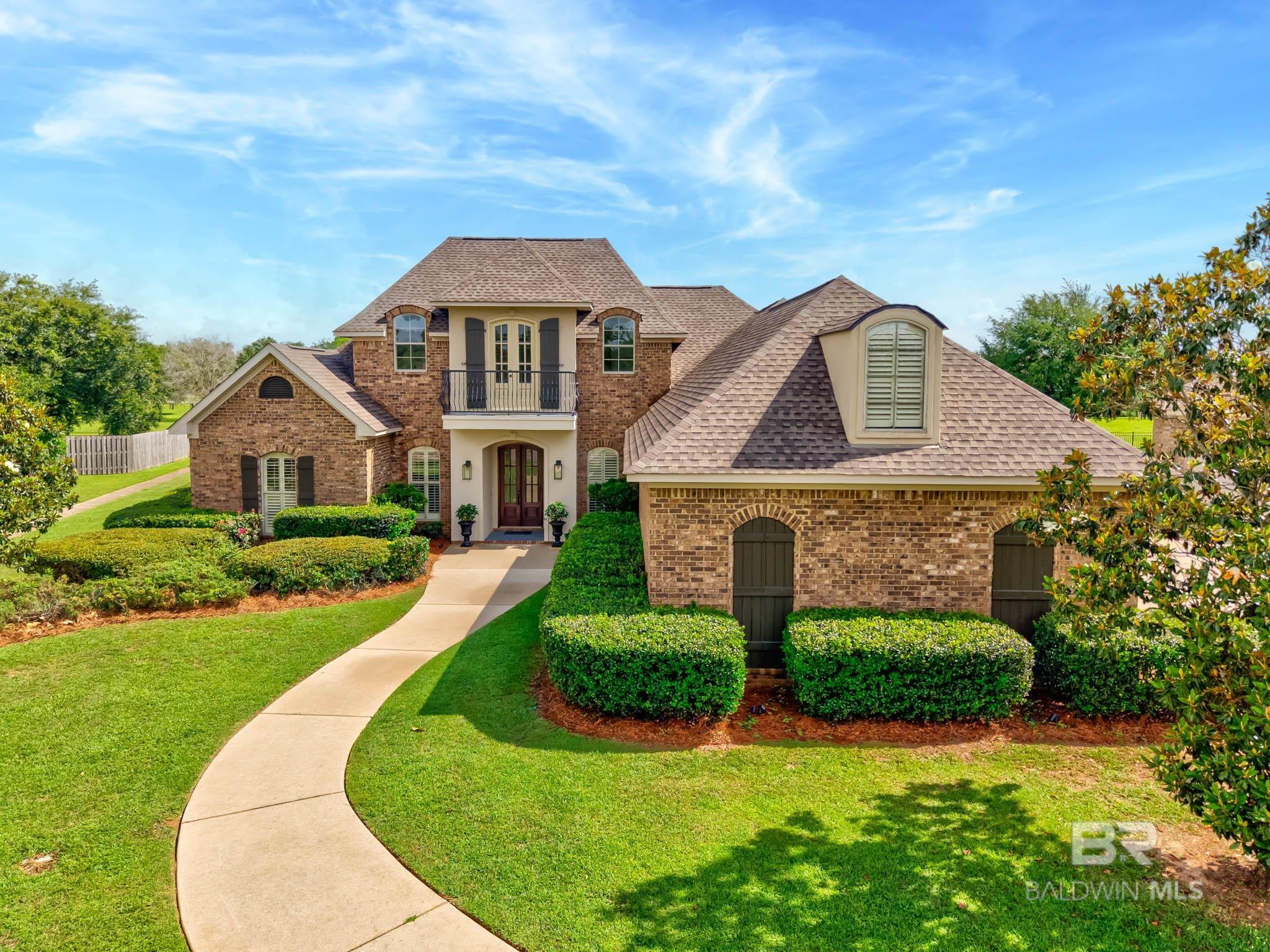 Exceptional custom-built brick home blends timeless elegance with refined modern upgrades. Freshly updated and move-in ready, this 5-bedroom gem in highly sought-after Avalon has been perfectly enhanced with new paint, modern fixtures, and stylish upgrades that make it feel like a brand-new home. You're welcomed by a stunning two-story living space with soaring vaulted ceilings, picture windows, rich wood flooring, and pure sophistication. The open-concept layout offers both a spacious living room and a cozy keeping room—each with its own fireplace—perfect for relaxing. The gourmet kitchen boasts custom cabinetry, gas cooktop, double convetion ovens, walk-in pantry, and an oversized granite island that anchors the space. The private first floor primary suite is a true retreat, featuring a sitting area with serene lake views and access to the enclosed porch, perfect for morning coffee. The spa-inspired ensuite presents a jet tub, walk-in shower, dual granite vanities, a separate makeup, and an extra large walk-in closet. Just steps away is a convenient modern first-floor laundry with high-end, energy efficient washer and dryer.Upstairs, the entire floor overlooks the beautiful downstairs living area below. You will find an additional spacious bedroom with its own full bath as well as a huge second-floor bonus room complimented with a front-facing balcony.Step outside to enjoy your private screened porch, luxury saltwater pool, and a well maintained pergola. The 26x26 detached garage provides extra parking and storage. Buyer to verify all information during due diligence. Open House 5/31 2-4pm & 6/1 2-4pm.