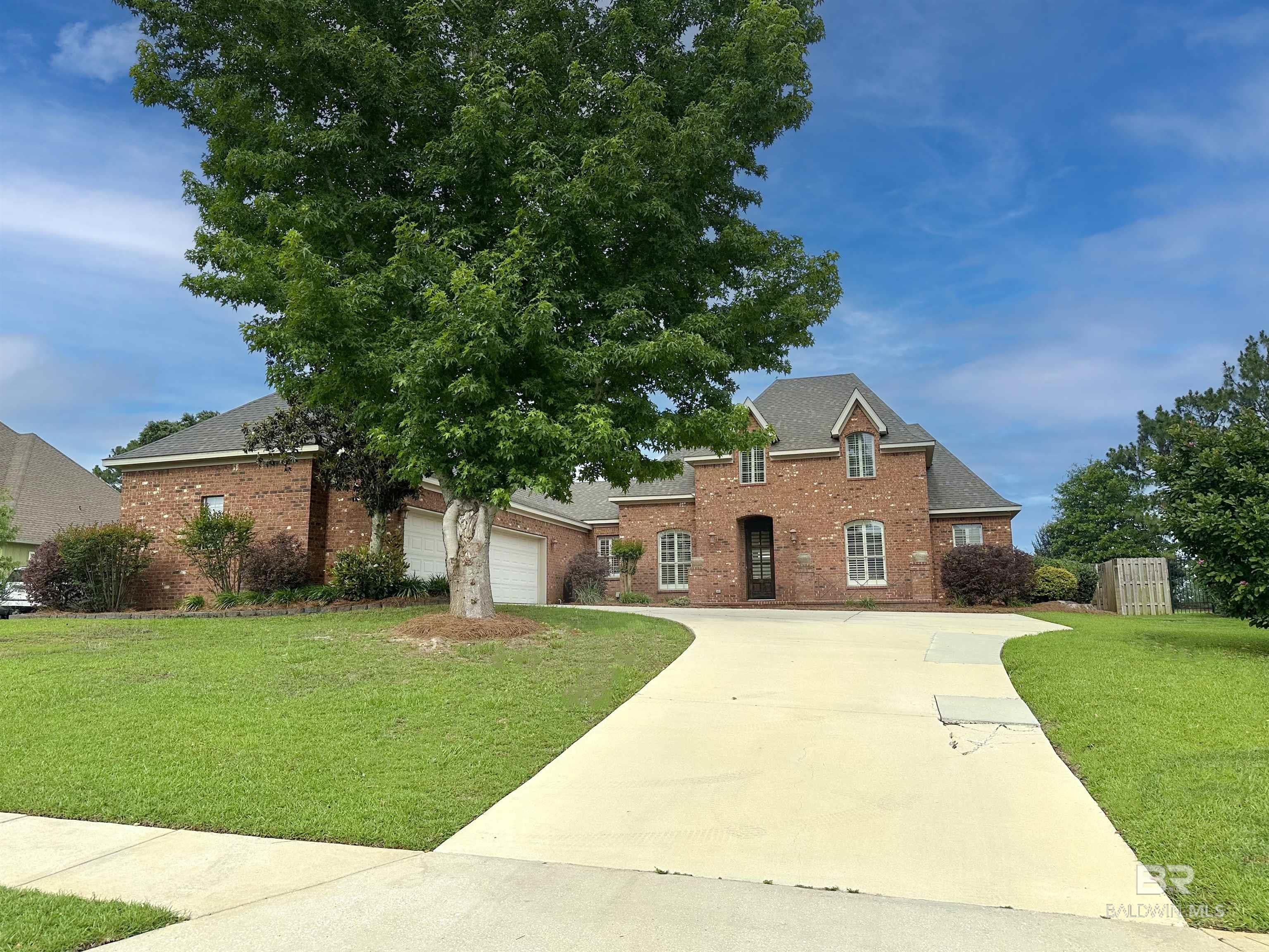 This is a Coming Soon Listing. Professional Pictures 6/4/25, Active by 6/5/25.  Welcome to this stunning custom brick French Country home nestled on nearly half an acre featuring 4 spacious bedrooms, 3 full bathrooms, a dedicated office, and a separate formal dining room, this home offers both comfort and flexibility. Step inside to find soaring 11-foot ceilings, elegant crown molding, and rich engineered scraped hardwood flooring throughout the main living areas. The front of the home is adorned with charming plantation shutters, while the living room boasts a cozy gas fireplace, custom built-in shelving, and cabinets. The gourmet kitchen is a chef’s dream with granite countertops, stainless steel appliances, a gas range, and a refrigerator that conveys with the home. Bedroom 2 is a private ensuite.  The freshly painted primary suite is tucked away at the rear of the home for ultimate privacy, complete with new roller shades, dual walk-in closets with custom wood shelving, two separate vanities, a large jetted soaking tub, and a separate shower. Enjoy peace of mind with a brand new inside/outside AC unit installed in June 2025 plus a NEW FORTIFIED Roof May 2024. Outside, the fenced backyard with a peach tree backs up to an open field, offering both serenity and space. The 3-car garage provides ample storage, and the home is eligible for a 5.249% assumable VA loan. Residents of Avalon enjoy access to a community pier and a scenic lake stocked with fish. Don’t miss your chance to own this exceptional property—schedule your showing today! Buyer to verify all information during due diligence.