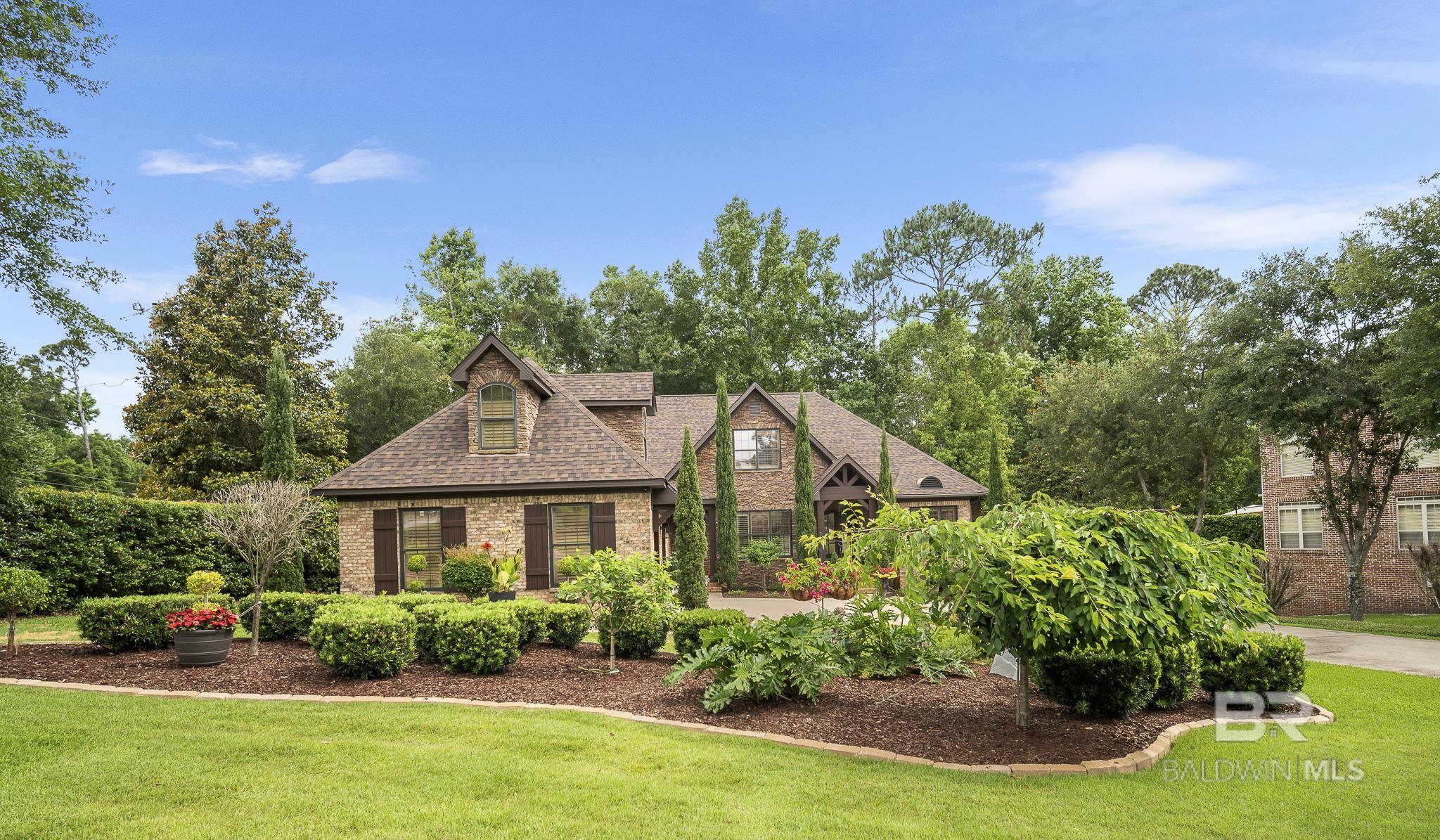 This stunning Colony Builders home offers exceptional craftsmanship and luxury finishes throughout, featuring a fortified roof that's just three years old for added peace of mind. The heart of the home showcases a gourmet kitchen equipped with premium Viking appliances, including dual ovens and a 6-burner gas stove, complemented by a new KitchenAid dishwasher, floor-to-ceiling cabinetry, a convenient pot filler, double sinks, and a spacious walk-in pantry. The kitchen includes counter seating, a charming breakfast room, and opens to a large hearth room, creating an ideal space for both everyday living and entertaining. Natural light floods the home through extended glass across the living room, opening up to the screened porch, which is accessible from both the breakfast room and living room, while two gas log fireplaces in the hearth and living room add warmth and ambiance. Architectural details include extensive molding and elegant coffered ceilings throughout. The primary suite serves as a true retreat with dual vanities, a large walk-in shower, and a soaking tub, while a separate office space provides the perfect work-from-home solution. Upstairs, discover a private suite getaway featuring all-new LVP flooring, two walk-in closets, and a cozy sitting room. Outside, enjoy completely new landscaping and hardscaping with a brand-new deck, all while being conveniently located just minutes from I-10, shopping, and restaurants. All information is deemed reliable but not guaranteed. Buyer to verify all information during due diligence. The chandelier in the formal living room is to be replaced. Picture of replacement fixture can be provided upon request.