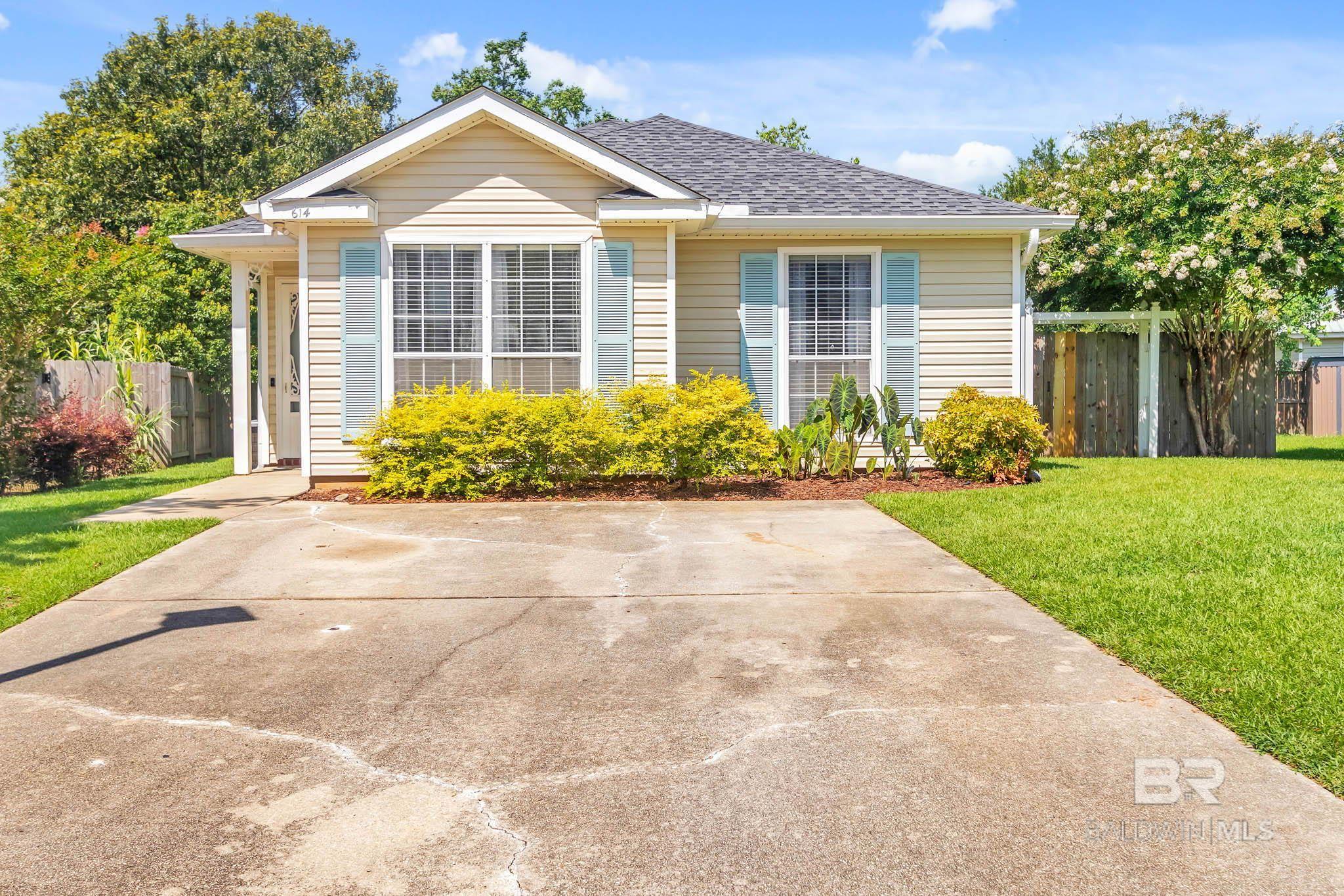 Charming Updated Cottage in Fairhope – Move-In Ready! Welcome to this adorable 3-bedroom, 2-bath Fairhope Cottage—the one you’ve been waiting for! Situated on an oversized, beautifully landscaped lot, this home is brimming with charm, updates, and modern convenience. Step inside to find new wood flooring throughout—that’s right, no carpet anywhere—along with fresh paint in every room. The cozy gas fireplace creates a warm, inviting living space, while the gas range in the kitchen will delight any home cook.The kitchen is a standout, featuring granite countertops, stainless steel appliances, and a refrigerator that conveys with the home. You’ll also appreciate that the washer and dryer stay, making your move-in a breeze. Major updates include a new roof and HVAC in 2020, new hot water heater  and AC service in 2023, dishwasher in 2024, new garbage disposal in 2024,  giving you peace of mind. Outside, enjoy the fully fenced backyard, complete with a new wood shed for extra storage and a lovely patio area—perfect for relaxing or entertaining. Don't miss your chance to own this updated Fairhope cottage—schedule your showing today!Vacant- Easy to show!! Buyer to verify all information during due diligence.