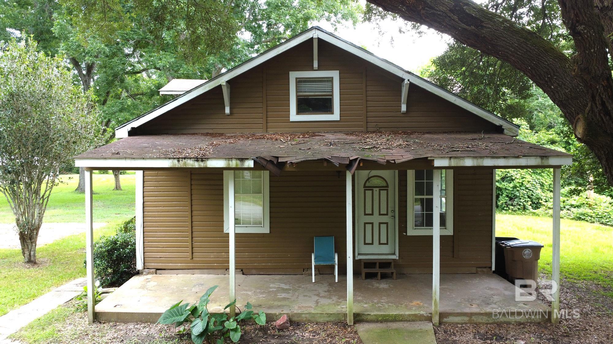 A rare opportunity to own a piece of Fairhope history less than a mile from the iconic downtown clock and all the charm of this beloved Gulf Coast town. Built in 1930 and set on an oversized 163' x 134' lot, this classic two-story home offers over 1,500 square feet of living space with endless potential.Inside, you’ll find an open floor plan with 3 spacious bedrooms, 2 full baths, and a convenient half-bath/laundry combo. The primary bedroom is located on the main floor, while two additional bedrooms upstairs each offer generous 11' x 15' dimensions. The kitchen, measuring 17' x 13', flows into a light-filled living and dining area that's perfect for entertaining or cozy nights in.Whether you’re looking to renovate, expand, or simply restore its vintage character, this home is ready to become your dream home. Enjoy life on nearly half an acre with plenty of room to create the outdoor oasis you’ve always wanted.Located in the heart of Fairhope and zoned for Fairhope East Elementary, Fairhope Middle, and Fairhope High School, this home offers a lifestyle as idyllic as its location.Don’t miss the chance to make this classic cottage your own—schedule your showing today and start dreaming! Buyer to verify all information during due diligence.