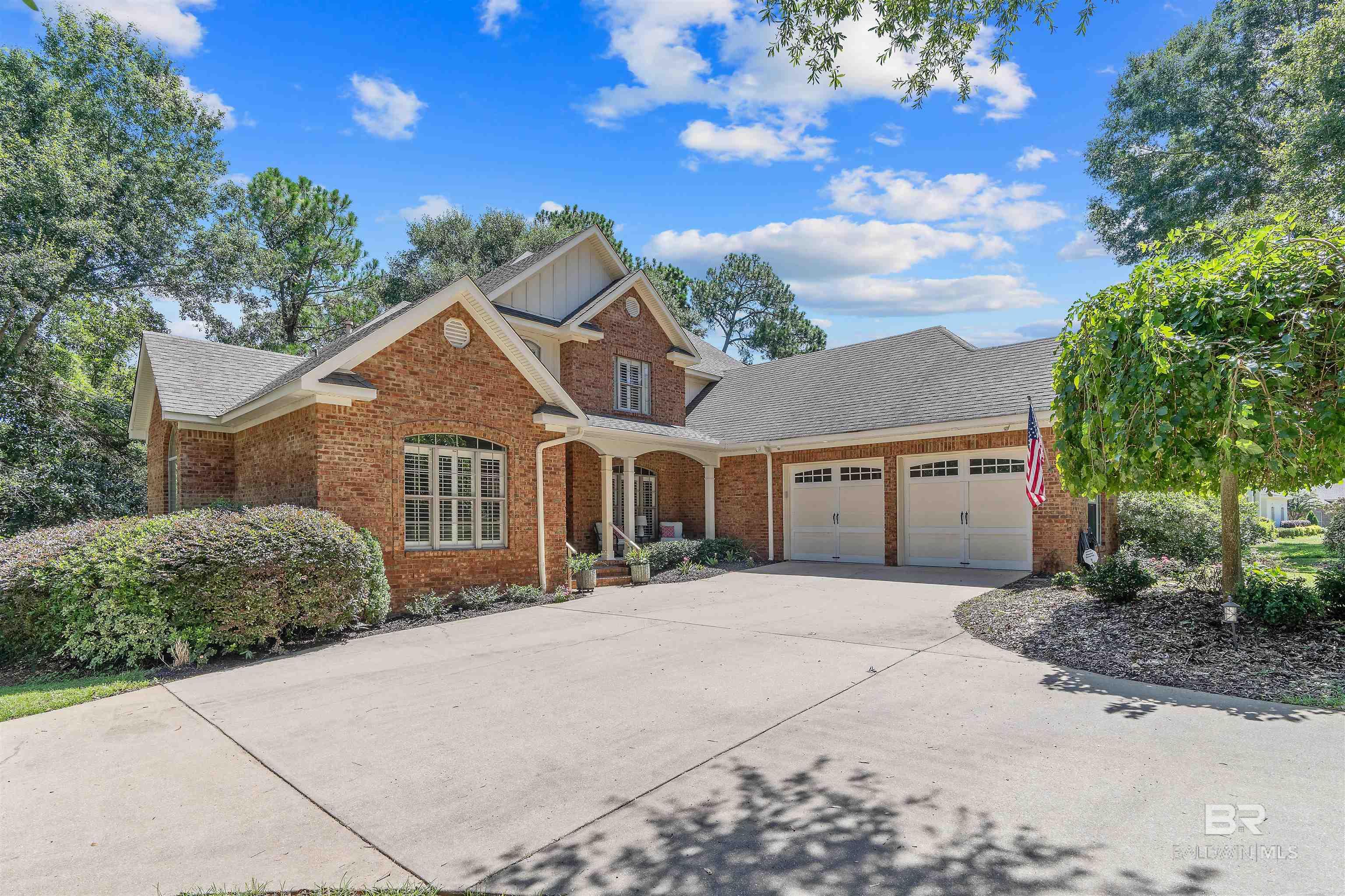 Beautiful home on a wonderful corner lot surrounded by lush trees in fabulous Timbercreek. The gorgeous entrance and majestic living room, with a stunning floor to ceiling wall of windows and grand staircase, are the centerpiece of the home's interior architecture. The floorplan is spacious and open with high ceilings  and new hardwood flooring for a perfect flow, and it's great for gatherings and entertaining. A thoughtful floorplan is perfectly designed to include a private office and a separate dining room that serves well as a casual den or more formal living room. Plantation shutters add to the elegant yet cozy ambiance. The primary suite has plenty of space, a large bath with double vanities, and is desirably located on the first floor. Nice, open kitchen and eating area has room to add a large dining table or create a separate seating area. The relaxation and outdoor spaces are one of the greatest features of this home with an enclosed back porch, large back deck, and fabulous back patio all overlooking the private back yard. The lower level is finished as an extra bedroom complete with a full bath and private entrance, great for guests. Recent updates include 3 new HVAC units, 2 tankless water heaters, whole house water filter with reverse osmosis water on kitchen sink, new dishwasher, new disposal, new front door, new handrails on front and back steps, new interior paint, new hardwood flooring, an epoxy finished garage floor, and new door handles. Timbercreek is a wonderful golf course neighborhood with plenty of amenities including a clubhouse, outdoor pool, exercise room and pickle ball courts. Close to the beaches of Gulf Shores and Orange beach and very close to the downtown Fairhope shopping experience and the waterfront park and pier. It really is a perfect location right across from the Eastern Shore center, grocery shopping and just minutes from I-10.  Buyer to verify all information during due diligence.