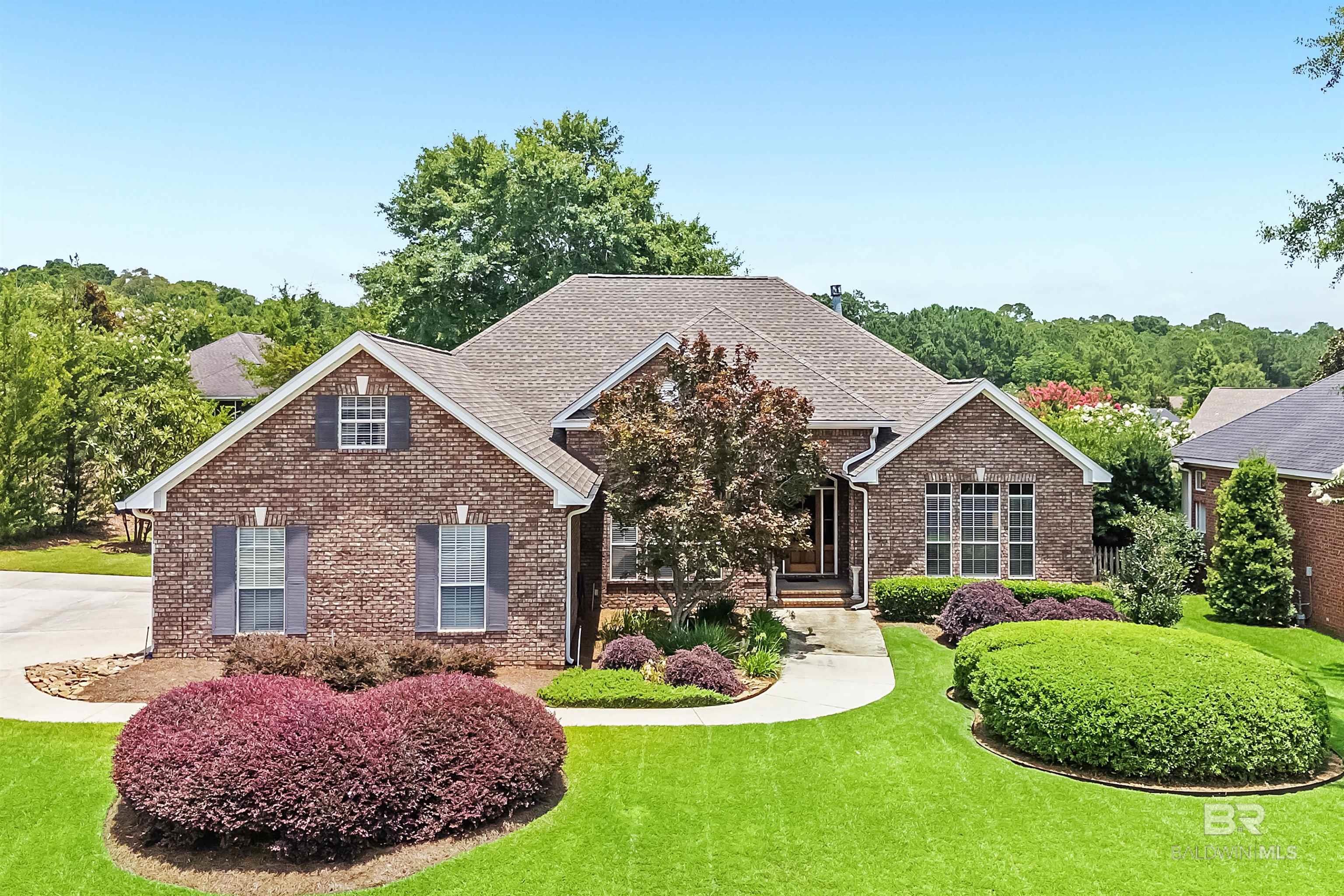 This beautifully maintained 4-bedroom, 3-bath single-story home exudes a warm, welcoming vibe. The meticulously groomed front yard leads you inside, where you'll find a lovely foyer opening into a spacious great room complete with built-in shelving and a cozy gas fireplace. The formal dining area is generously sized, while the kitchen boasts granite countertops, a built-in microwave, and an electric range, along with a breakfast area that overlooks the backyard. The primary bedroom features hardwood floors, and its adjoining bath offers a water closet, shower, jet tub, double vanities, and a large walk-in closet. On the other side of the house, you'll find three additional bedrooms and two baths, including a convenient Jack-and-Jill bath. Enjoy your morning coffee or evening barbecues from the screened porch and patio. This home also includes a fortified roof (renewed in 2029), a sprinkler system, a side-entry garage, and new plumbing and water heaters (2020). Located in the prestigious TimberCreek golf course community, you'll have access to pools, a fitness center, tennis courts, and a clubhouse. Plus, it's super convenient to shopping, restaurants, schools, and I-10 for easy commuting Buyer to verify all information during due diligence.