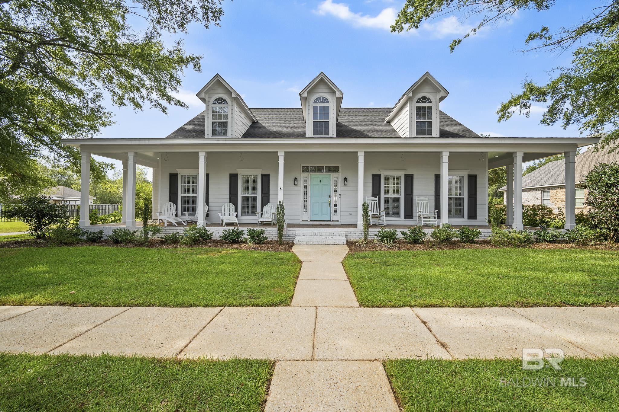 This beautiful home is nestled within an established tree-lined neighborhood with easy access to all all Baldwin County and Lower Alabama have to offer.  Paradise cannot fully describe the outdoor gathering spaces surrounding the pool and hot tub, which can be enjoyed all year round.  The home's layout lends itself to ease and relaxation.  A separate formal dining area complements a newly remodeled chef's eat-in kitchen with stainless steel appliances, quartz counters, and on trend painted cabinets and cement tile backsplash with cabinetry and storage for days.  The primary suite is conveniently located on the main floor. There is one additional bedroom on the main level with a hall bath, and two bedrooms upstairs with a hall bath.  One of the bedrooms includes a private nook for studying, writing, or dreaming!  The bonus is a heated and cooled office space just off the breezeway to the detached garage.  Beyond the pool grotto is a large drive and separate parking pad.  This home is perfect for multi-generational living.  Fortified Roof, upgraded plank flooring.  All information is deemed reliable but not guaranteed. Buyer to verify all information during due diligence.