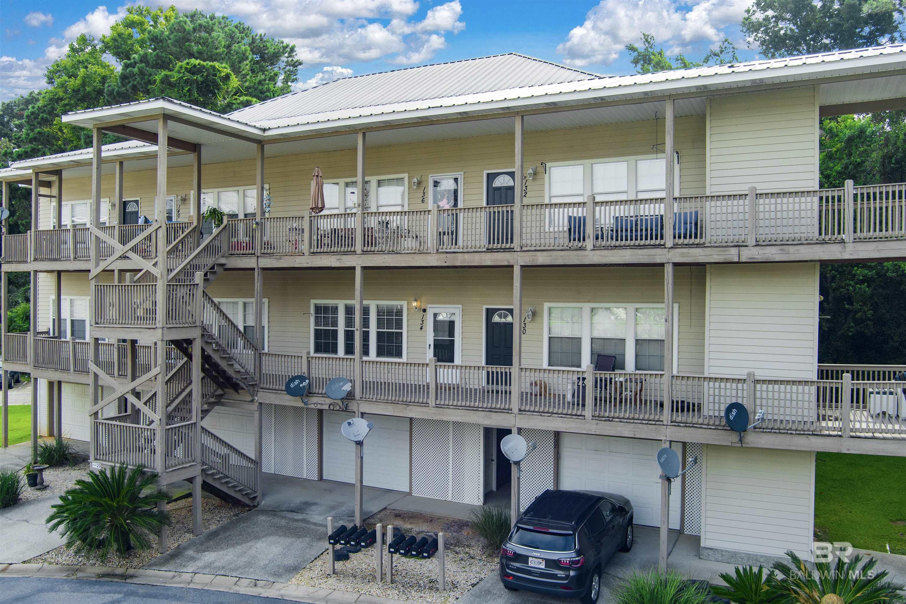 Updated 2-Bedroom Condo in Gated Sunset Bay Villas | Daphne, ALWelcome to this beautifully updated second-floor condo located in the sought-after gated community of Sunset Bay Villas in Daphne. Offering the perfect blend of comfort, style, and convenience, this move-in ready 2-bedroom, 2-bathroom home features 10-foot ceilings and elegant tile flooring throughout.The kitchen is a true showpiece, boasting granite countertops, sleek grey cabinetry, black appliances, and a spacious granite breakfast bar—ideal for casual dining or entertaining. The open-concept living area flows seamlessly onto the rocking chair front porch, where you can unwind with stunning sunset views overlooking the tranquil lake.Additional highlights include a private one-car garage with extra storage space, in-unit washer and dryer (to convey), and access to premium community amenities such as an elevator, pool, hot tub, scenic lake, boardwalk, and a pier extending into Mobile Bay.Perfectly located near shopping, dining, and just under an hour from Alabama's beautiful white sand beaches, this condo offers both lifestyle and location.Don’t miss your chance to own a piece of paradise—schedule your private showing today!All information is deemed reliable but not guaranteed. Buyer and buyer’s agent to verify all details. Buyer to verify all information during due diligence.