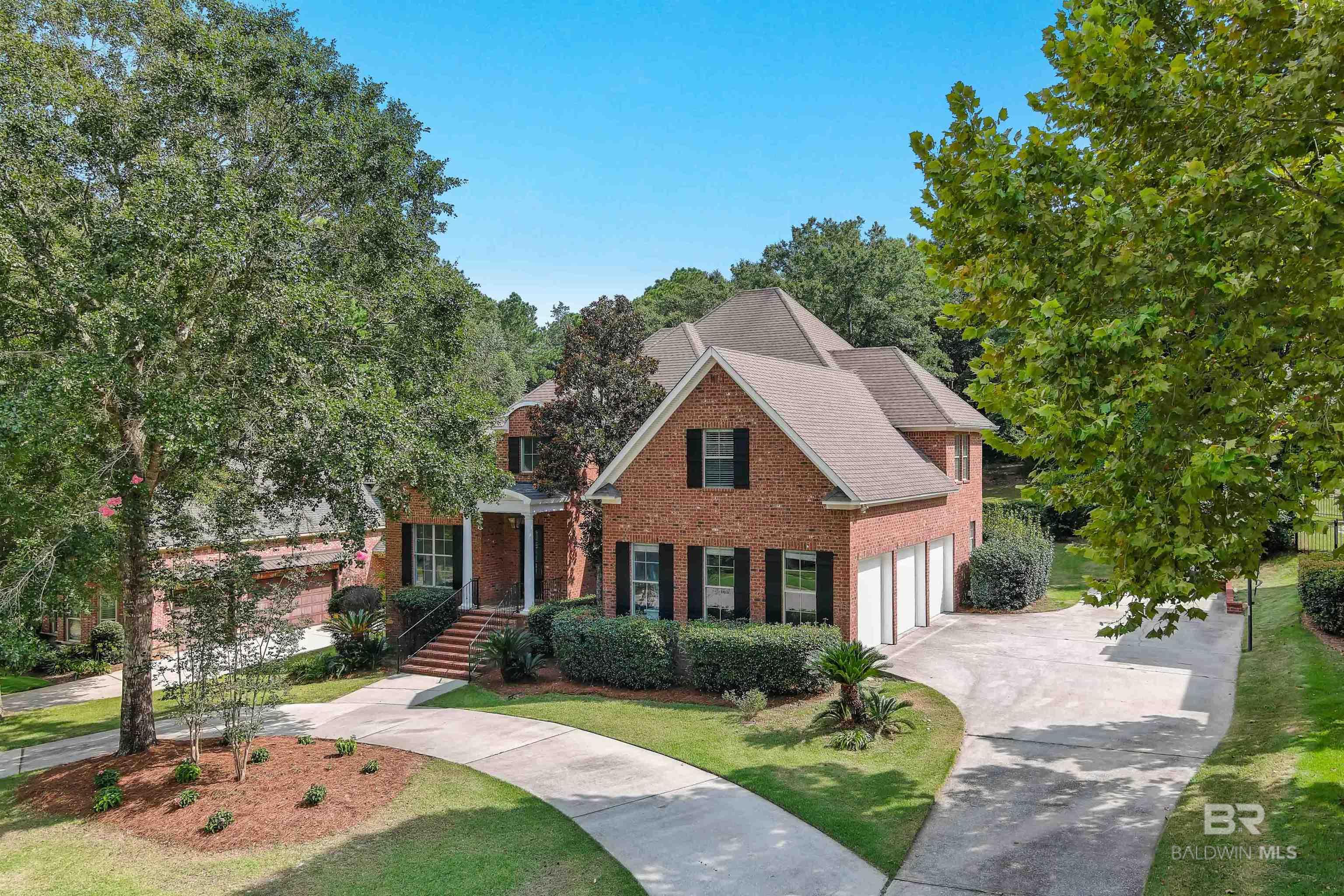 Coming Soon. Open House Sun 8/10 1-4.  Elegant custom home on the 6th tee of The Magnolia Course in the highly sought-after TimberCreek subdivision. This 5BR/3.5BA elegant custom residence is the epitome of refined living—offering a timeless exterior & layout, w/ modern upgrades, and an enviable backyard made for year-round entertaining.Reimagined, the kitchen, bathrooms, dining, and living areas have all undergone a top-notch renovation with no detail overlooked. From the brand-new carpet throughout the upstairs to the designer fireplace, and reinvented primary ensuite, this home is a perfect blend of classic Southern charm and sleek modern style.Featuring 5 spacious bedrooms, 3.5 baths, and a versatile bonus room at the front of the home, this layout offers flexibility and flow. Step into the foyer & you’ll find a formal dining room to the right & a flex room to the left, w/ abundant natural light at every turn. The foyer opens into a stunning spacious living room with high ceilings, a gas log fireplace as the focal point, to the right the reimagined kitchen featuring new countertops, walk-in pantry, & high-end stainless steel appliances.The primary suite is located om 1st floor, boasting a newly tiled walk-in shower, brand-new soaking tub, a walk-in closet complete with custom built-ins. Upstairs, four additional bedrooms offer space and comfort, with a thoughtful layout: 3 bedrooms share a Jack-and-Jill bath, another has an en-suite bath and views of the pool and backyard, while the final bedroom includes a charming window-side seating nook. Backyard is an entertainer’s dream with screened porch, brick fireplace, builtin grill, and gunite pool with waterfall. 3-car garage, mudroom, tankless water heater, and more. TimberCreek offers golf, clubhouse, fitness center, pools, sports courts, and RV/boat storage. Zoned for award-winning Spanish Fort schools and just minutes to beaches, shopping, and dining! Buyer to verify all information during due diligence.