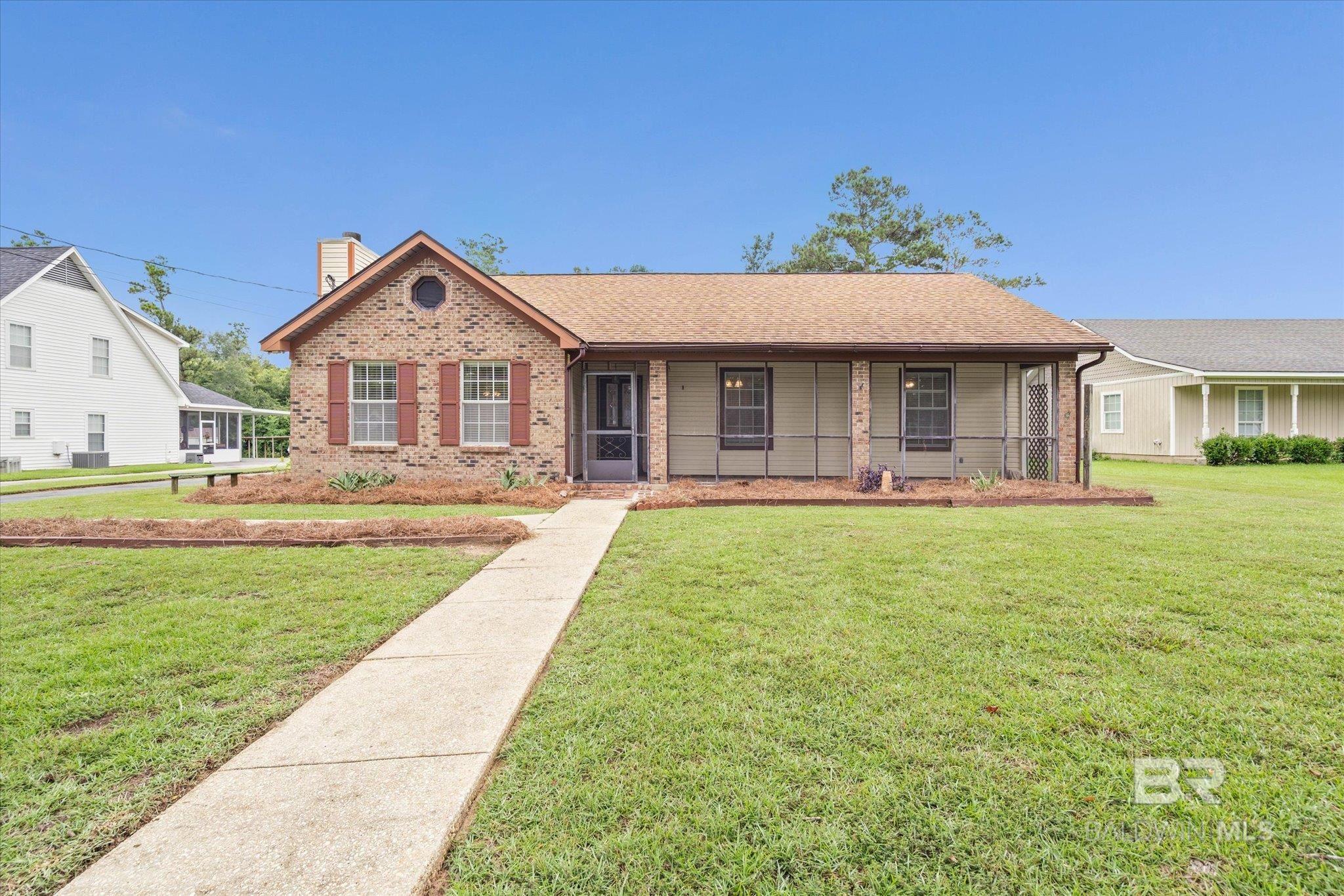Hard to find in Fairhope under $300,000  is this Charming 3BR/2BA brick ranch nestled in a quiet Fairhope subdivision. This home features vaulted ceilings in the living room. The dining area is conveniently located just off the living room with a pass-through to the kitchen—perfect for entertaining. Relax on the screened rear porch overlooking the peaceful backyard. Property includes a detached carport, storage/workshop building, and an RV pad. Fortified roof and new HVAC system installed just a couple of years ago. Great location and value in the heart of Fairhope near schools and shopping. Contact your favorite Realtor and give it a look.  Buyer to verify all information during due diligence.
