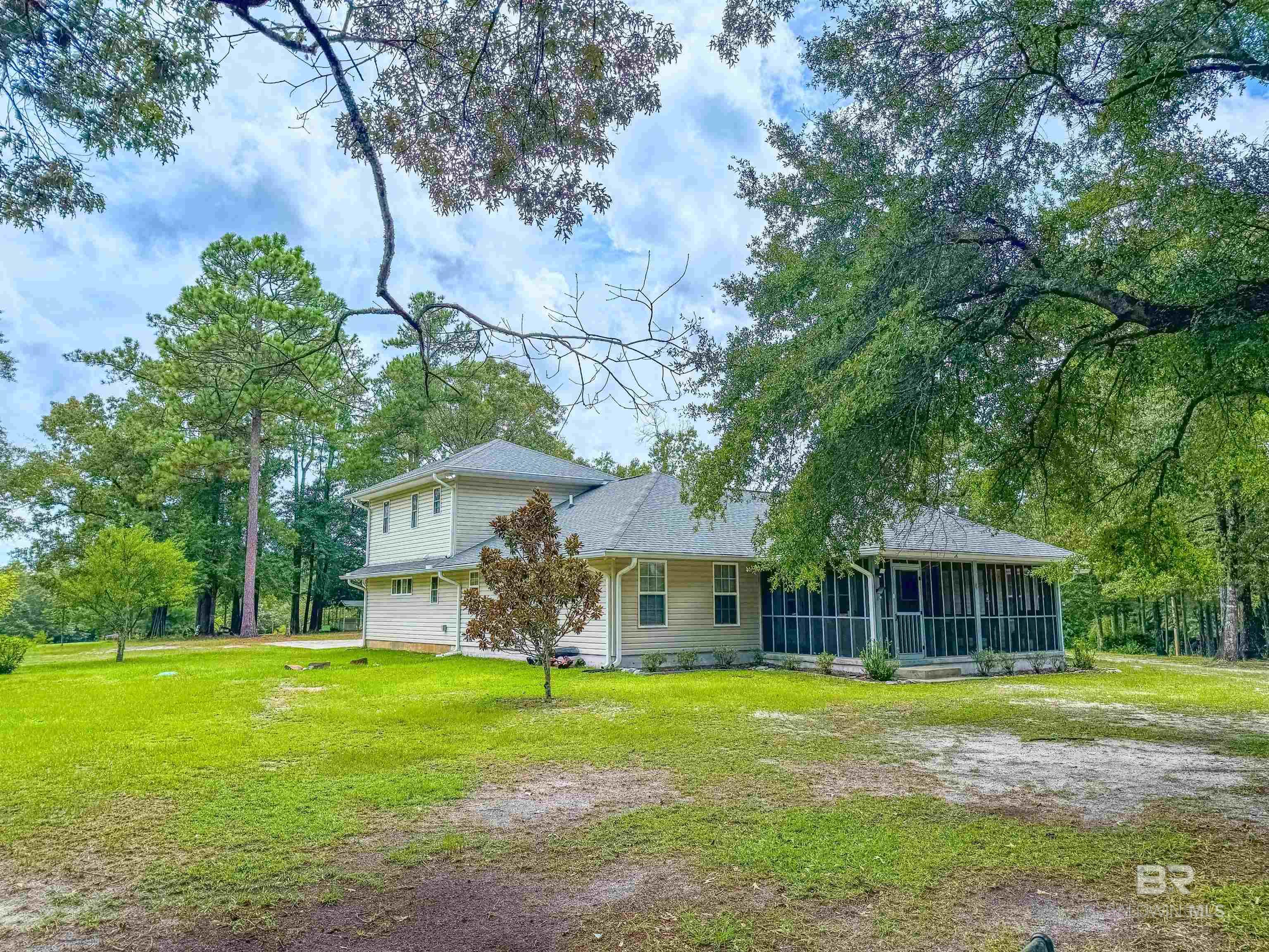 New Listing! Nestled on 20 and a half serene acres in a peaceful rural setting, this spacious 5-bedroom, 4-bath home offers the perfect blend of comfort, functionality, and country charm. Inside, you’ll find a formal dining room, a separate office for work or study, and a generous kitchen complete with the cutest built-in vegetable drawers!  The screened porch is ideal for relaxing afternoons, while the property’s (three!) pole barns and storage building provide ample space for equipment, hobbies, or livestock. Located in the Pleasant Home Community and neighboring the Conecuh National Forest.. Whether you’re dreaming of a homestead, hobby farm, or simply a private retreat, this property is ready for you to make it your own… just bring the cows! Let's go look!  Buyer to verify all information during due diligence.