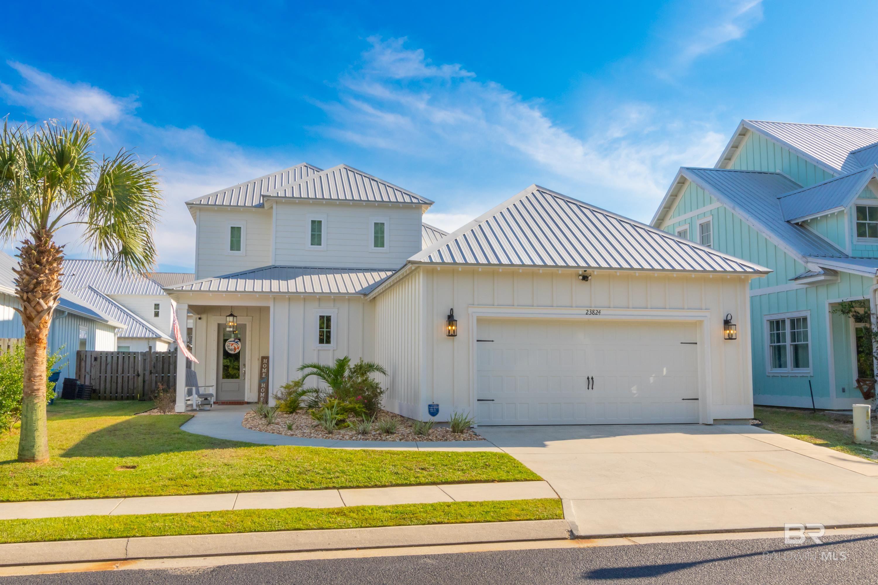 Discover a rare opportunity to own one of the largest floor plans in this sought-after Orange Beach community! Situated on a quiet, no-through street overlooking a peaceful pond, this home offers the space, layout, and lifestyle that are hard to find in today’s market at this price. Step inside to an open-concept living, dining, and kitchen area with a large walk-in pantry, abundant storage, and NO carpet—just beautiful TILE PLANK flooring throughout. The primary suite is conveniently located on the main level with a spacious bathroom and closet, a convenient 1/2 bath is located in the hallway leading to the garage while upstairs features additional bedrooms both with private bathrooms & walk in closets. A versatile landing area at the top of the stairs is perfect for an office, play area, or flex space. This home is move-in ready with major upgrades already in place: TWO brand-new A/C units, a WHOLE HOUSE GENERATOR installed in 2022, extended back patio for entertaining, and GOLD FORTIFIED CONSTRUCTION for the best insurance rates. Located in Flood Zone X where flood insurance is NOT required.  Beyond the home, the neighborhood amenities are unmatched—resort-style pool with a lazy river, and located adjacent to The Wharf’s restaurants, music, and entertainment. The location is ideal being across the street from the brand-new Orange Beach Middle & High School - the city school system has only heightened demand for this incredible location & town.  If you’ve been waiting for a spacious, turnkey home in Orange Beach with unbeatable amenities and convenience, this is it!  Welcome to paradise!! Buyer to verify all information during due diligence.
