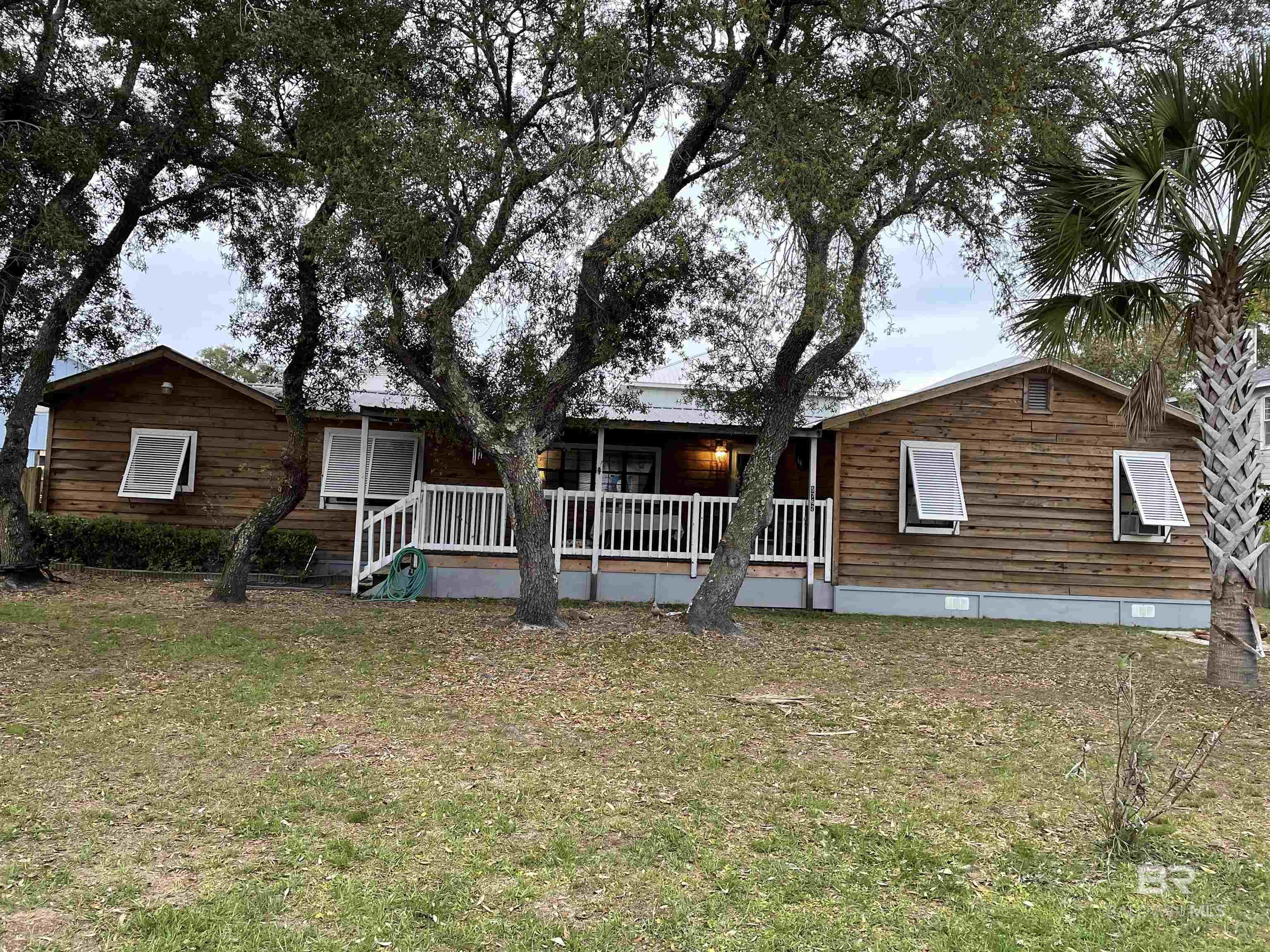 Charming Coastal Cottage in the Heart of Bear PointBuilt in 1968, this timeless coastal cottage is brimming with the charm and character that makes Bear Point one of the most beautiful communities on the Alabama coast. Nestled right in the heart of Bear Point, this cottage offers the perfect blend of laid-back living and unbeatable location. Enjoy the true coastal lifestyle—hop on your golf cart and take a short ride down to OSO for sunset drinks and dinner with friends. With stunning evening views and a community known for its welcoming atmosphere, you’ll quickly see why Bear Point is such a special place to call home. Classic 1968 construction with authentic coastal character, located in the highly sought-after Bear Point community with a short golf cart ride to OSO and Bear Point Harbor close to local beaches, shopping, dining, and entertainment. Endless opportunities to make this cottage your own coastal retreat. With an outdoor shower and covered porches this beachy home will be the perfect addition to your families vacation oasis. Whether you’re looking for a weekend getaway, a rental investment, or a forever home by the water, this cottage has everything you need to embrace the Bear Point lifestyle. Don’t miss the chance to own a piece of coastal history in one of the most beloved communities on the Gulf Coast. Buyer to verify all information during due diligence.