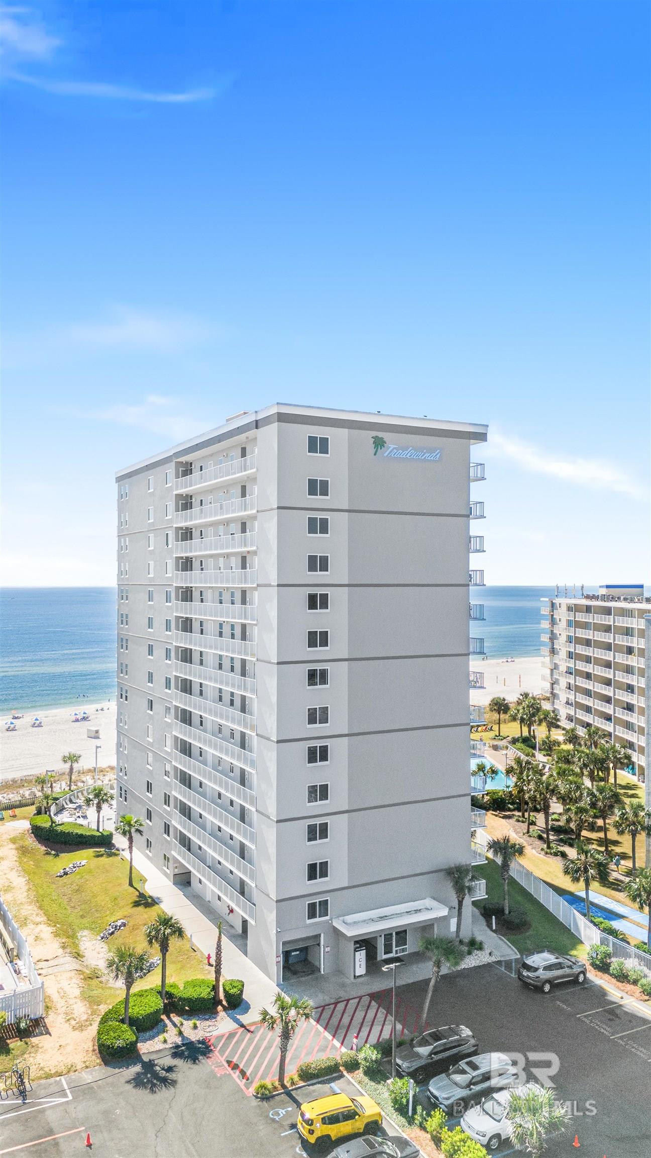 When looking for a condo to purchase, you want to invest in a complex that has been well maintained! This is it!!! Improvements include: Roof2021/2022, Security Cameras 2023, Lighting & Landscaping 2023/2024, 2 new elevators 2021, 2 new water booster pumps 2023, New Fire System 2024, Paint/repairs to building and balconies 2024, Renovated pool/decking/gates 2024 & repaved parking lot 2024 (buyer to verify all information with the association). Don't miss this beautifully Furnished Two Bedroom and Two Bathroom Condo in the Popular Tradewinds Condominiums. This unit features tile flooring, stainless appliances, separate laundry room with a stackable washer and dryer and Amazing Views of the Gorgeous Beaches. Tradewinds has so much to offer including: Indoor and Outdoor pool, BBQ area, ample lot parking and is convenient walking distance to Restaurants, Entertainment and Shopping. Experience all that coastal paradise has to offer! This Gulf-front complex unit is perfectly situated on the 11th floor! Offering breathtaking views of the shimmering Gulf from the balcony, this unit truly captures the magic of beachfront living. The open-concept layout ensures effortless transitions between the living, dining, and kitchen areas, all designed to maximize both comfort and functionality. The huge laundry room is something you don't find often and is perfect for storing all your beach equipment! Call today for a showing! Buyer to verify all information during due diligence.