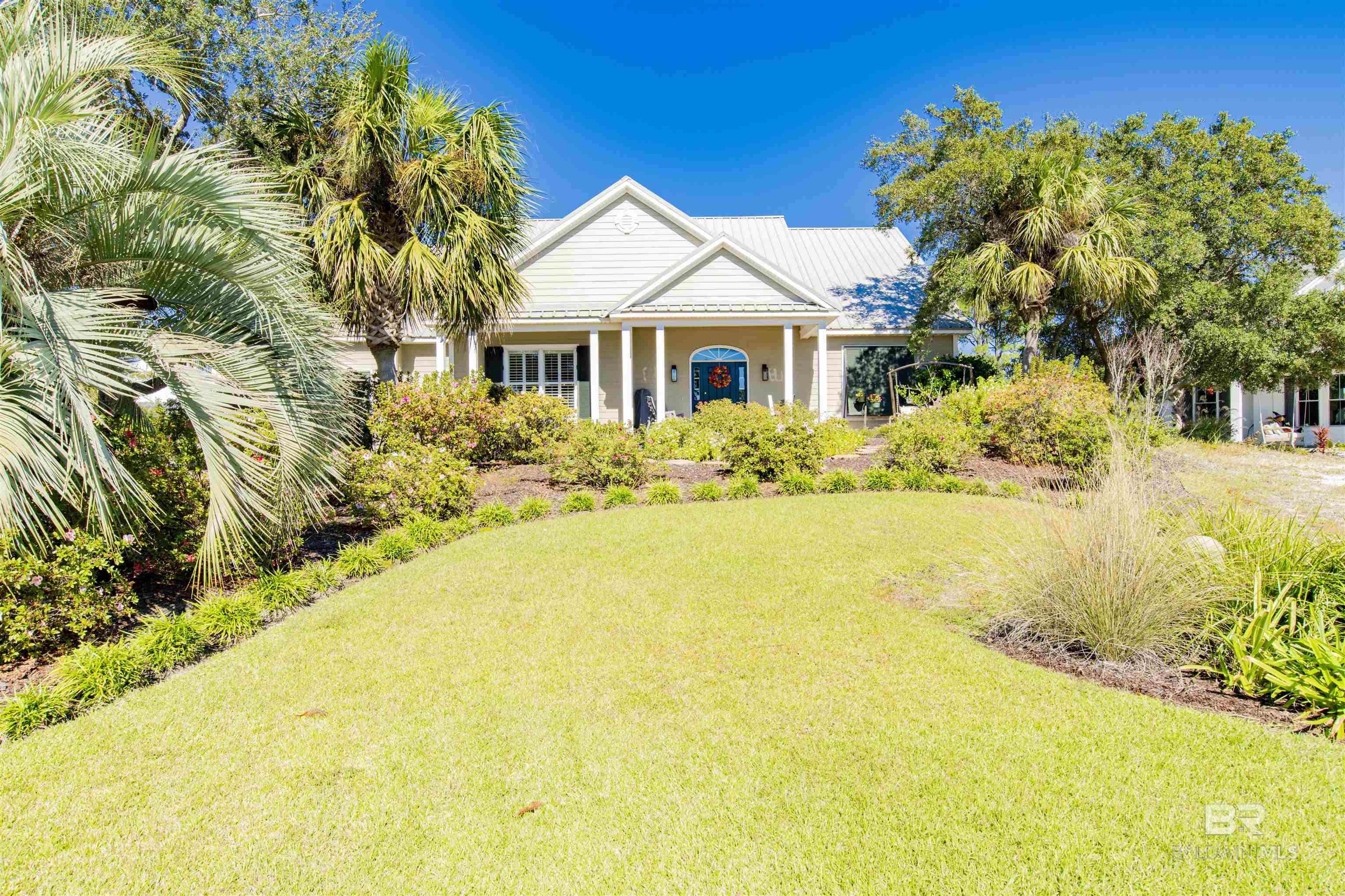 Walk in the front door, and you'll feel like you've just entered your Forever Home!  This 4 bedroom 3 bath home, with 3164 SF, is located at the end of the Cul de Sac on Osprey Ct in the Ono North section of Ono Island.  This Home is on an elevated lot and has never flooded.  The landscaping is beautiful, and easily watered with a sprinkler system and well water.  The home has had multiple updates including a new metal roof in 2021. In 2018 owners added an 80 gallon commercial Westinghouse, with a lifetime warranty.  In 2019, owners replaced the flooring in the living areas and kitchen with wood-look luxury vinyl and new carpet in the bedrooms, as well as tile in the baths.  In 2023, owners enclosed the 14'X26' screened in porch and extended the large living space with a 364 SF Sunroom, with high impact  transom windows that overlook multi level decks for grilling and entertaining,  A Split AC unit keeps it comfortable year round.  Large bedrooms on the main floor share a Jack & Jill bath and  the 4th bedroom on the second floor has its own bath, along with a flex space that could also be used for extra guests.  The primary suite is separate with large primary bath, huge walk in closet and adjacent laundry room conveniently located off the over sized garage.The kitchen has a large cabinet pantry with shelving and drawers, a double oven, and back splash. Yearly Dues for the Ono North Center is $400/per year and includes tennis courts, basketball court, pickle ball courts, an olympic sized outdoor pool, and heated indoor pool, along with a fitness Center.  There is a boat launch on the island for convenient boating access to the Gulf of Mexico, the intracoastal waterway, and numerous back bay fishing holes.  It's the ideal home on an exclusive island for an off-island price.   Buyer to verify all information during due diligence.