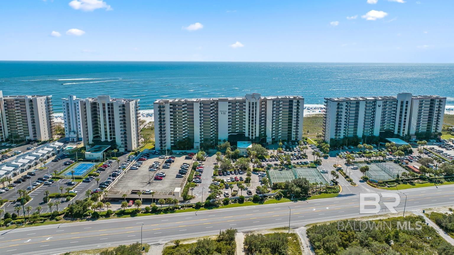 Beautiful Gulf Waters, & Sugar white sands are just steps away from this Direct Beachfront 2-bedroom 2-bathroom condo in Orange Beach! NEW floor-to-ceiling glass balcony doors open up to Spectacular views from this 14th floor at Phoenix VII.  The large kitchen and wet bar area are perfect for entertaining family and guests. The primary bedroom is gulf front and balcony access. Enjoy Incredible Sunrises & Sunsets from your living area and your Master bedroom. The large balcony also offers amazing views of The Pass, for all of you boat lovers! This nicely decorated unit has tile throughout, Furnished, with High ceilings! Phoenix VII has wonderful amenities including: Large outdoor pool, Indoor pool, Fitness Center, Hot tub, sauna, lighted Tennis courts, Racquet ball court, shuffle board, pickle ball, gazebo, BBQ area, security guard check-in and easy Beach access! Conveniently located to dining, shopping and entertainment!   Buyer to verify all information during due diligence. WELCOME to PARADISE! Set up a showing to see it soon!!