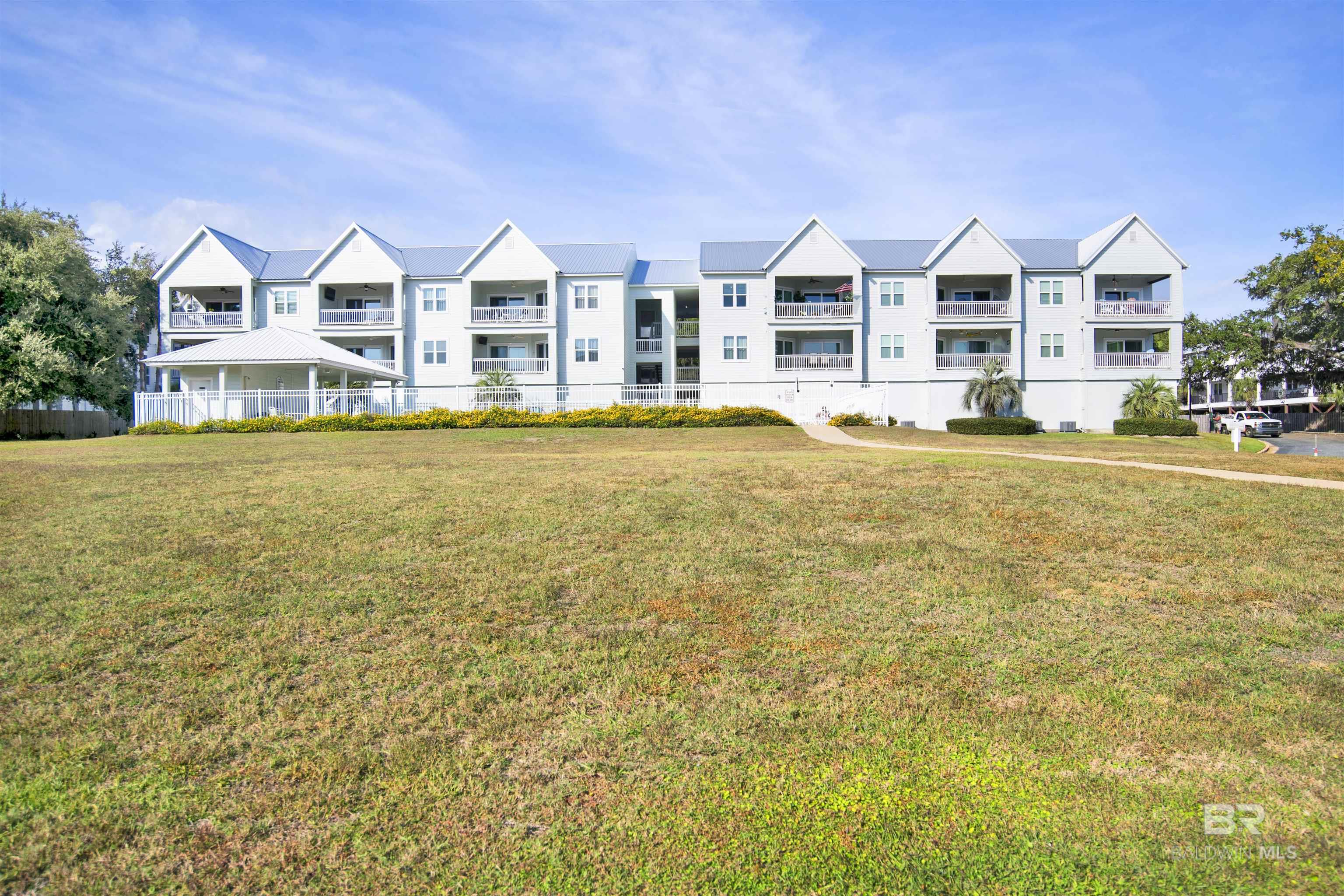 Enjoy the bay living lifestyle with your very own deeded boat slip. This property has it all: two pools, boat slips, bath house, and amazing views. Walker Key complex is just like new with newly installed impact windows, sliding doors, new paint, new deck railings, a new roof, and an additional pool overlooking the bay. In addition to the complex being like new, this unit has been totally updated with fresh paint, LVP high-end quality flooring (no carpet or tile). The master has views of the pool and the bay. The master barn door leads to a luxurious, updated master bath. The shower is brand new with beautiful tile and a solid glass door. The total cost of the shower exceeded $15,000. The HVAC for the unit was installed after Sally. The kitchen is absolutely gorgeous with beautiful tile and granite countertops. All appliances are only two years old. Unit comes with two covered parking spots, a deeded boat slip, and awesome storage. The storage building includes a toilet, a place for a fridge, and a dishwasher. Storage also includes an expensive rod carrier in the ceiling that is automatically controlled. Building G is one of only two buildings that have an elevator. Ask your buyer to verify all information during due diligence.   Buyer to verify all information during due diligence.