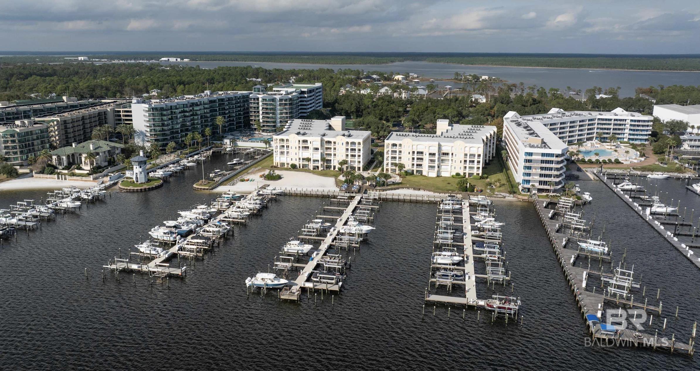 Want a direct waterfront condo along Terry Cove with a deeded boat slip? Look no further than Perdido Grande 403 in Orange Beach, AL! This complex is in the perfect location...located on Canal road, directly adjacent to Sportsman's Marina, and a short boat ride to Robinson Island/Perdido Pass! Imagine being able to walk directly to your deeded slip and enjoy a day out on the water, whether it's on the bay or in the gulf!Not only does the waterfront access make this property unique, this complex features an indoor pool/hot tub, outdoor pool, fitness gym, sauna, and tennis courts! It also has a gated entry for increased security. Unit 403 is located in the west building on the 4th floor. Featuring 3 bedrooms and 3 full bathrooms, this 2081 sq ft unit will not disappoint! Decorated with beautiful decor, cozy furniture, and spacious rooms, the whole family can fit comfortably! The unit features an open concept kitchen/dining/living area with direct balcony access. Balcony access also accessible from the master suite. Enjoy your morning coffee and evening sunsets with the beautiful views of Terry Cove and the marina!Whether you're looking for a primary residence, secondary home, or rental investment, this property can offer it all! Contact your favorite realtor and schedule your showing for this beautiful condo! Buyer to verify all information during due diligence.