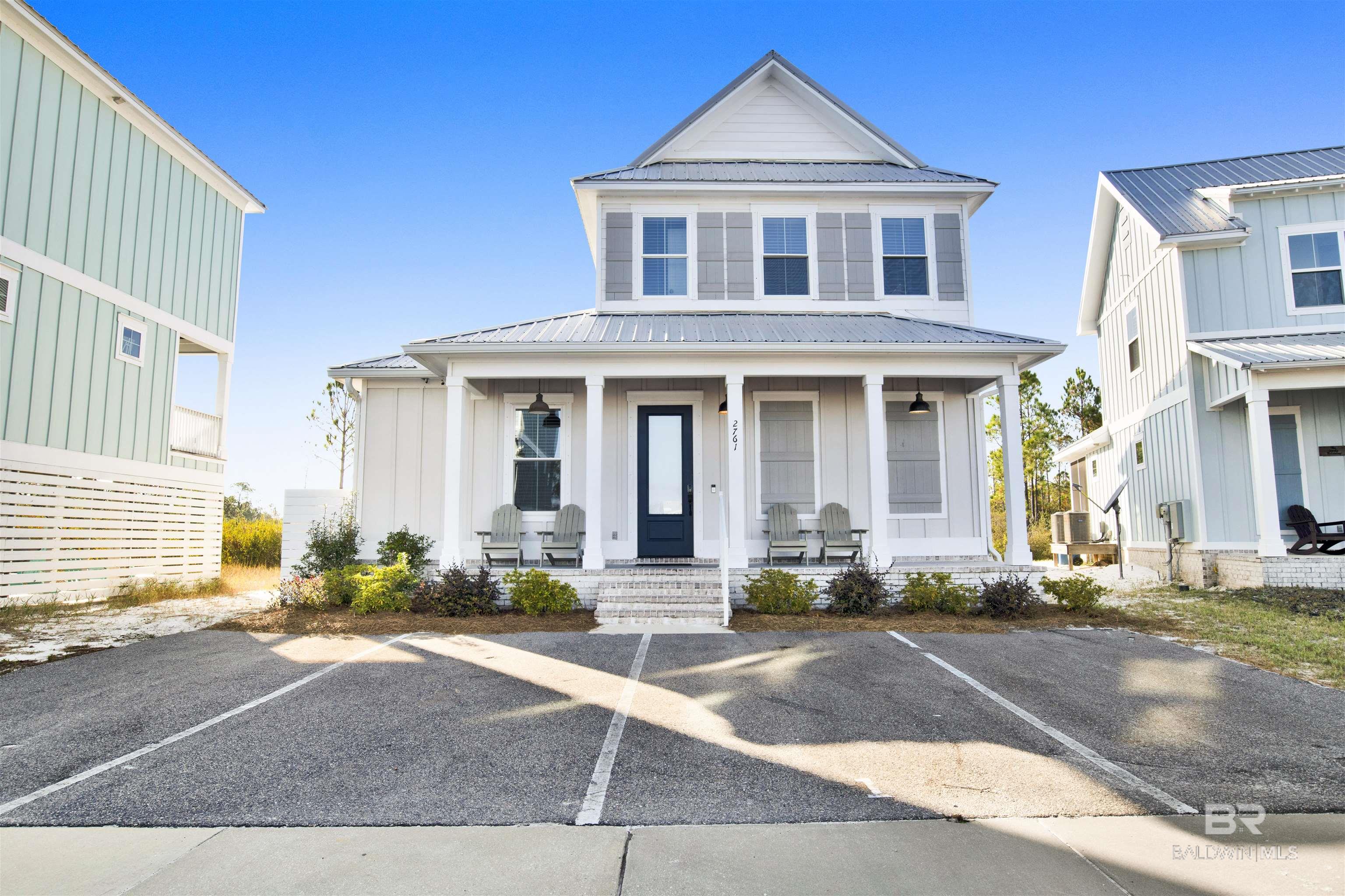 This is the Sandbar Model Home with great upgrades. Upgraded painted cabinets ,flooring, plumbing fixtures and tile. The kitchen features Calacatta Vicenza Granite, an apron front sink and a 5 burner gas range. Highly desired EVP flooring throughout main living areas and all bedrooms. Total connect home package which includes a Ring doorbell with a Zmodo outdoor camera, Android tablet, Smart Home Hub, programmable Ecobee 4 thermostat, and Connect 2 wave deadbolt on the front entry.  4 assigned parking spaces. The Home was built to Fortified Gold standards. Lake and nature filled neighborhood with a resort style zero entry pool and entertaining cabana. The neighborhood has a community fire pit, and putting green. This home backs up to the State Wildlife Area. Walk to local restaurants and entertainment. Short term rentals are allowed. Buyer to verify all information during due diligence.