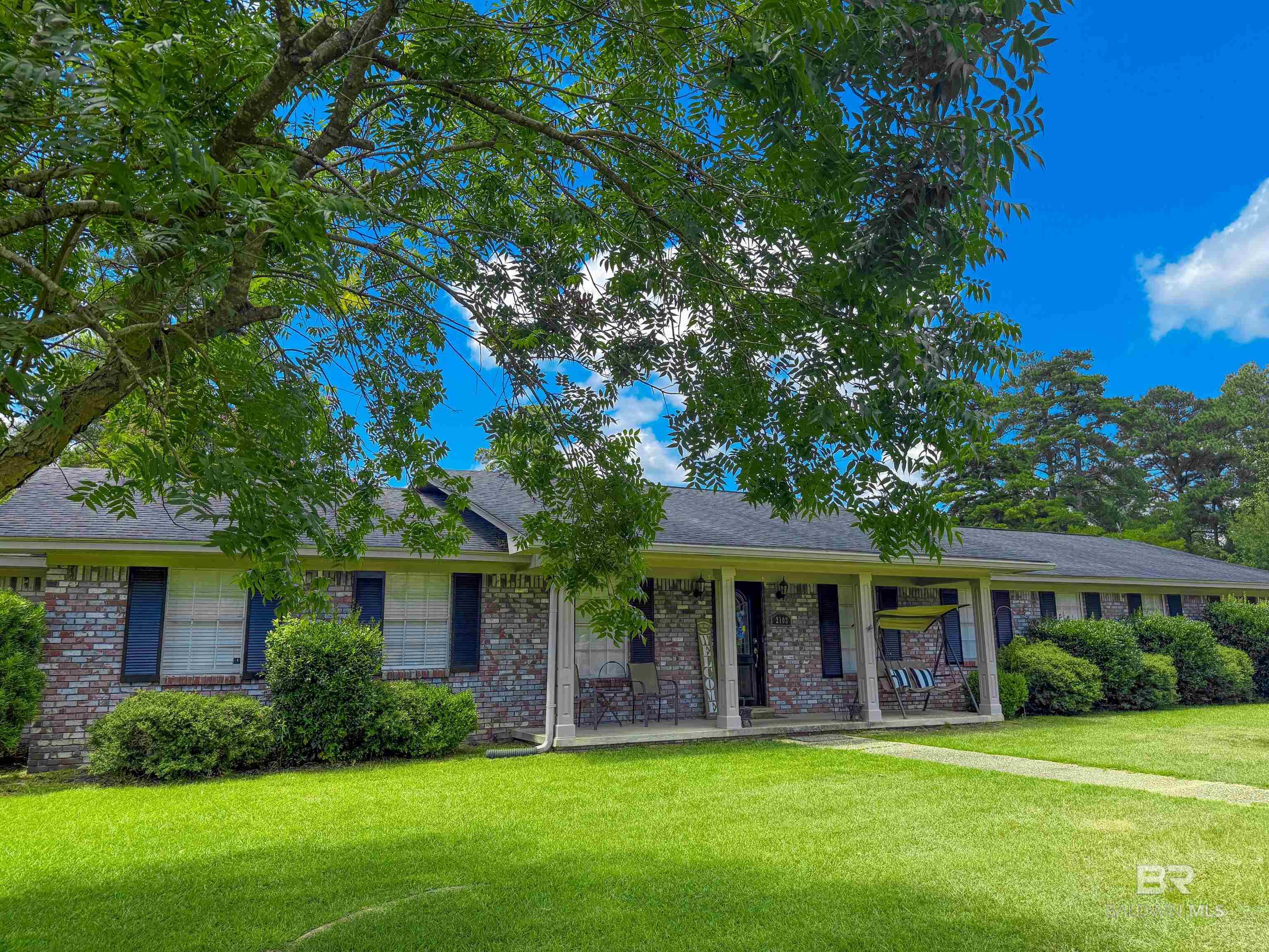 Spacious & Full of Charm in Brewton, Alabama! This 4-bedroom, 2-bath home combines classic style with plenty of room to spread out. The open kitchen flows into a cheerful breakfast room, while a formal dining room sets the stage for special gatherings. Multiple living spaces-including a formal living room and a comfortable den-offer flexibility for entertaining or relaxing. Sunlight pours in through large windows, creating a bright, inviting feel throughout. Step outside to enjoy the screened back porch, perfect for year-round use, a fenced backyard (complete with a storage building), and a double garage with work area and storage! Located in a quiet Brewton neighborhood, this home is ready to welcome you! Let’s go look!  Buyer to verify all information during due diligence.