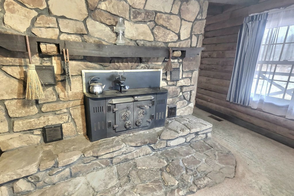 Wood burning fireplace is cozy in the living room
