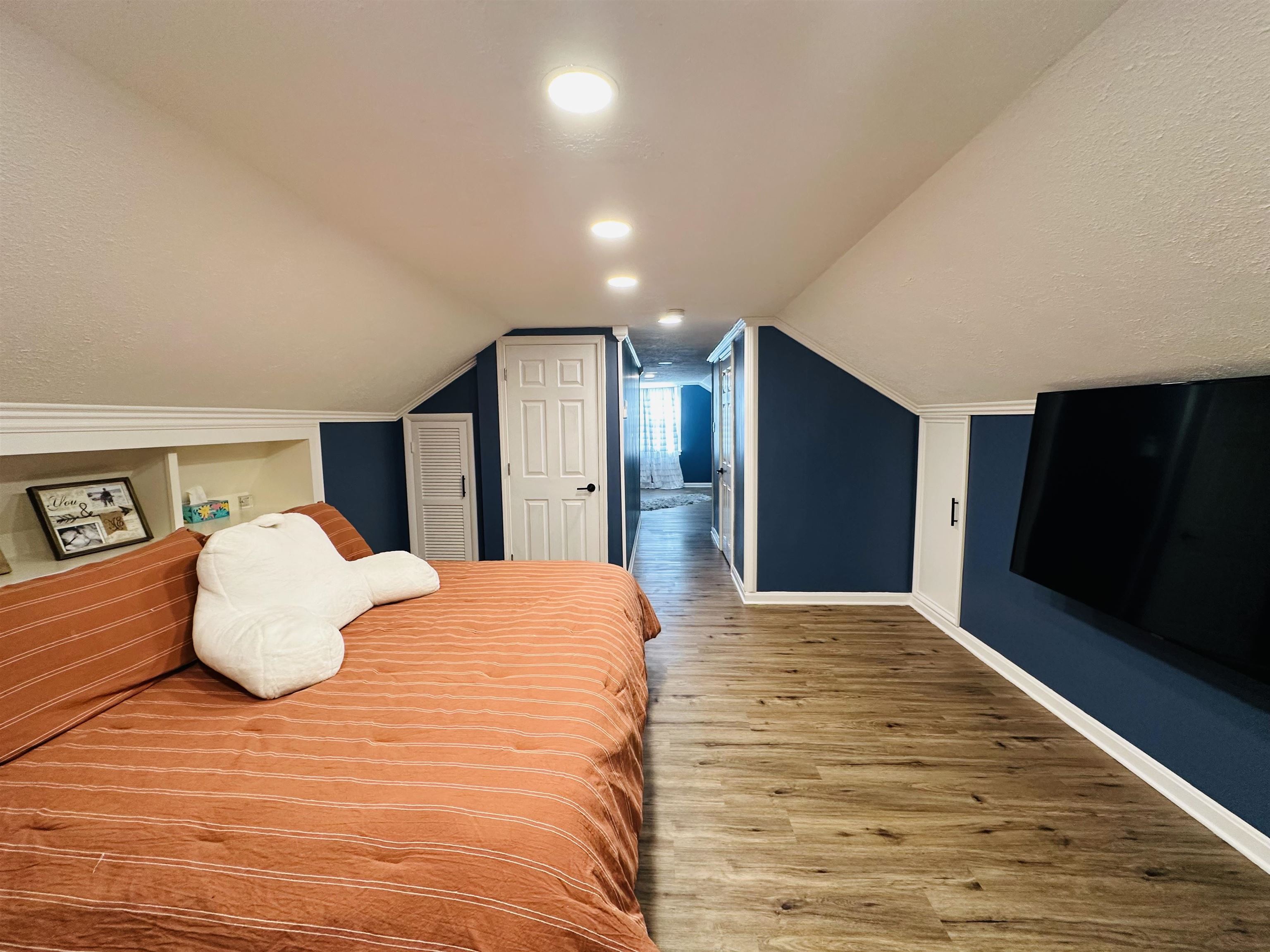 Entire upper level is the private owner's suite to include half bath and walk-in closet.