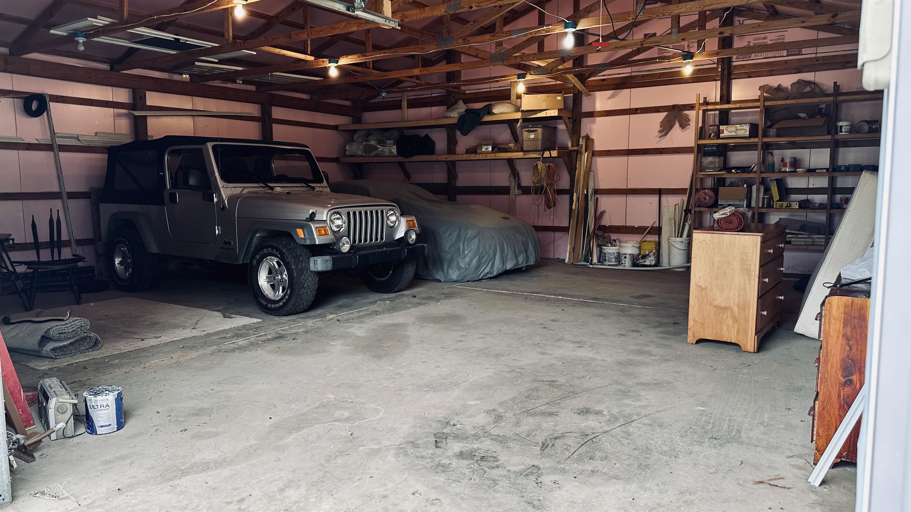 30x30 with electric. Could possibly fit 4-5 cars.