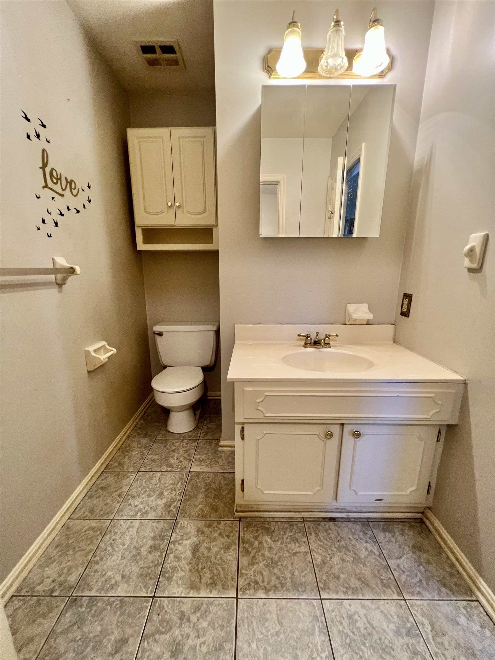Walk-in closet off of half bath