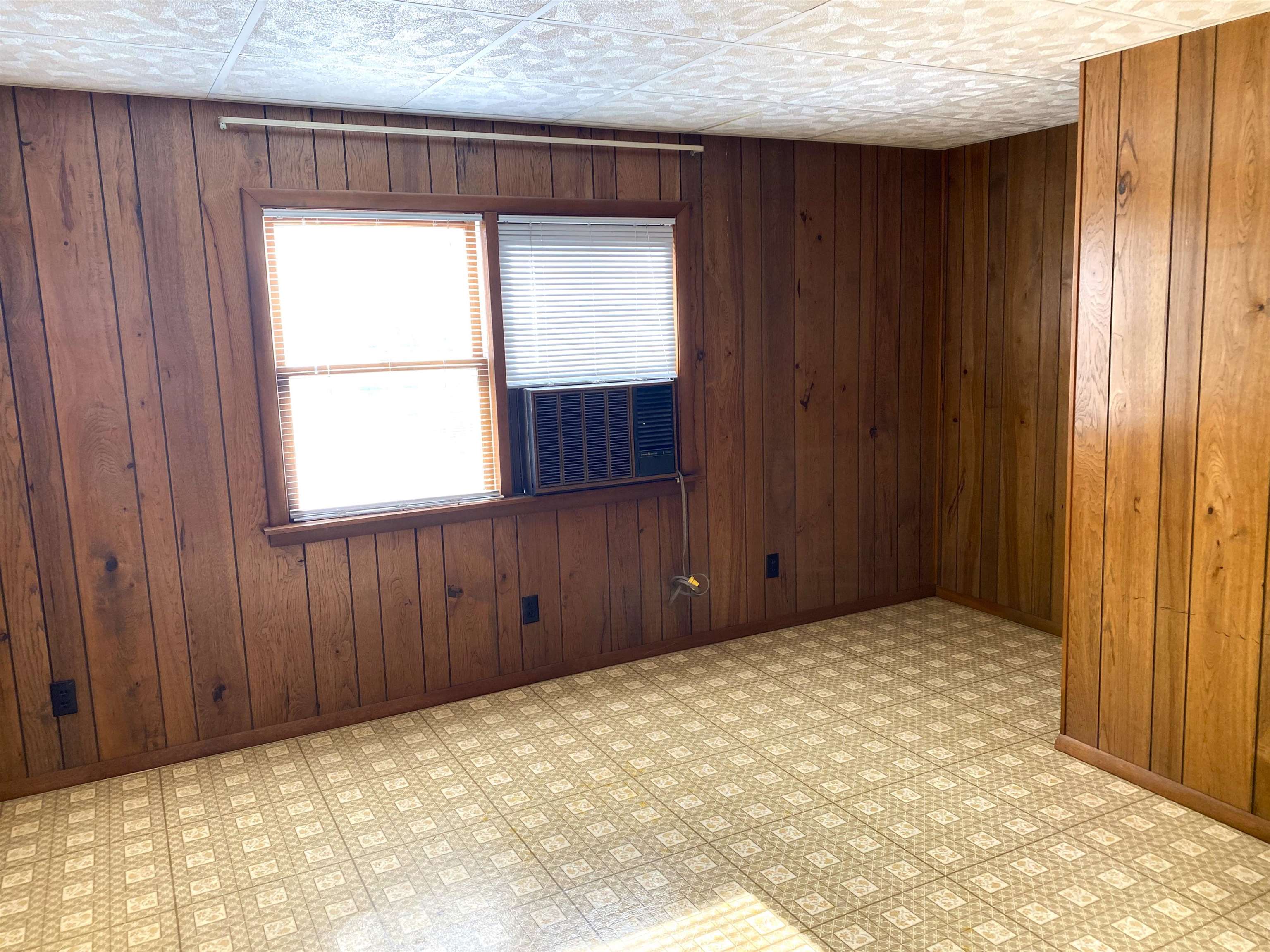 This main level room offers it's own separate entrance and has a 1/2 bath.  Office or toy room