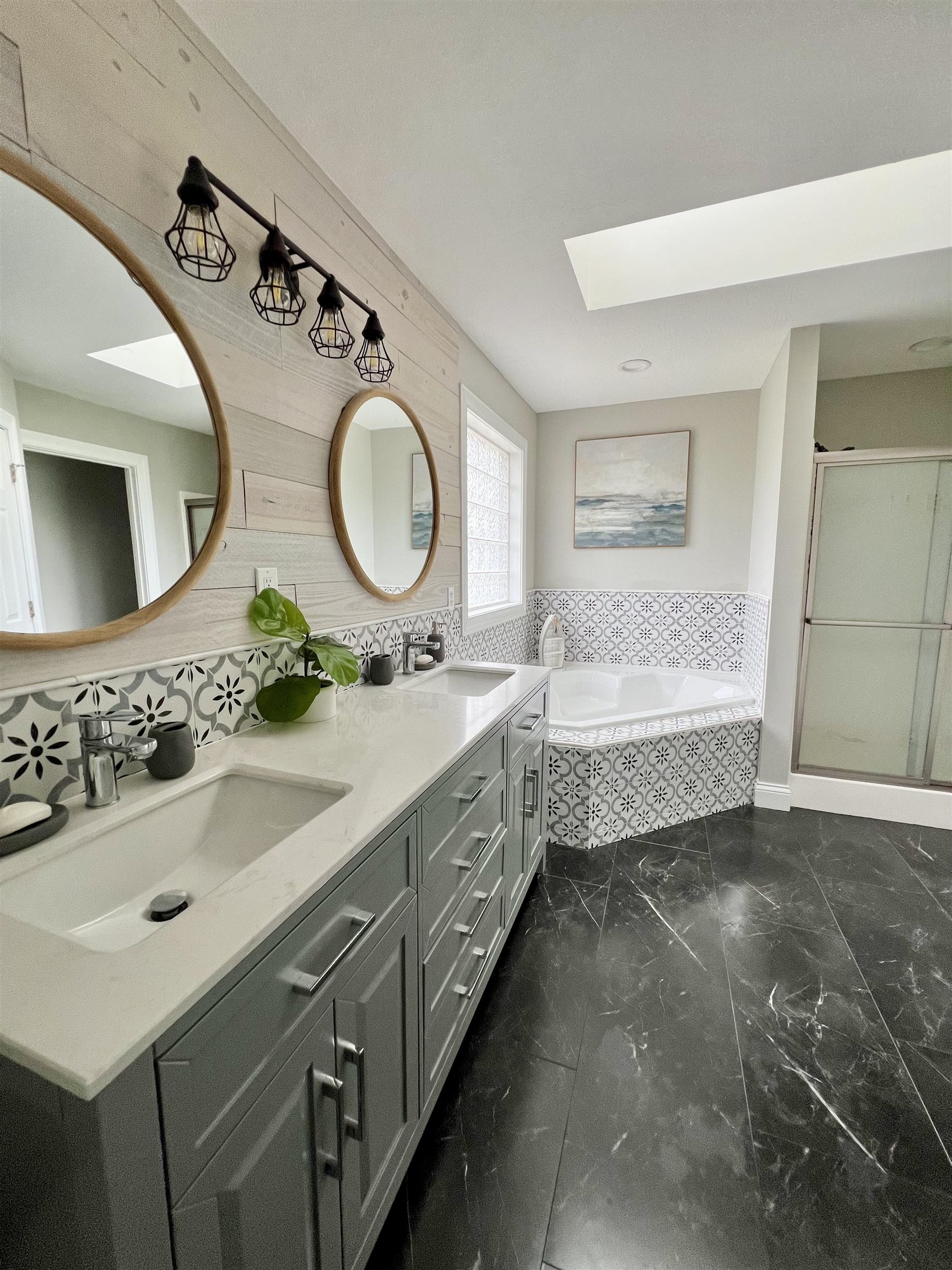 Updated with walk-in closet and shower, jetted tub, double vanity, and private water closet.
