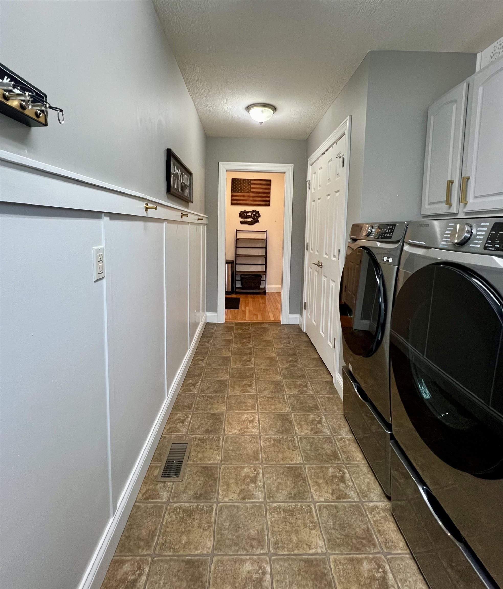 Includes utility closet and cabinetry and utility sink.