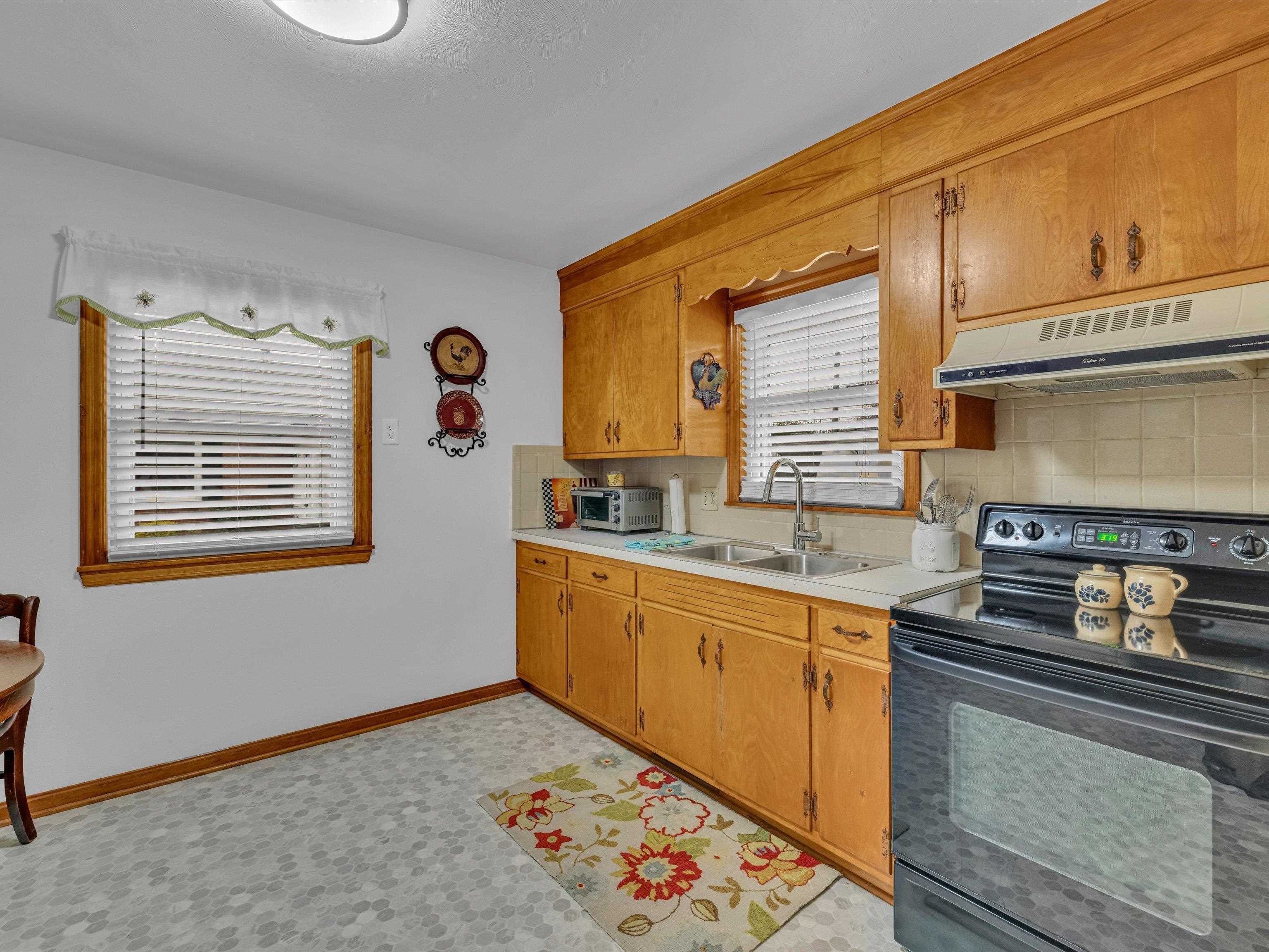 Kitchen sink has a new faucet. Two windows in kitchen for lots of natural light. New Floor linoleum.