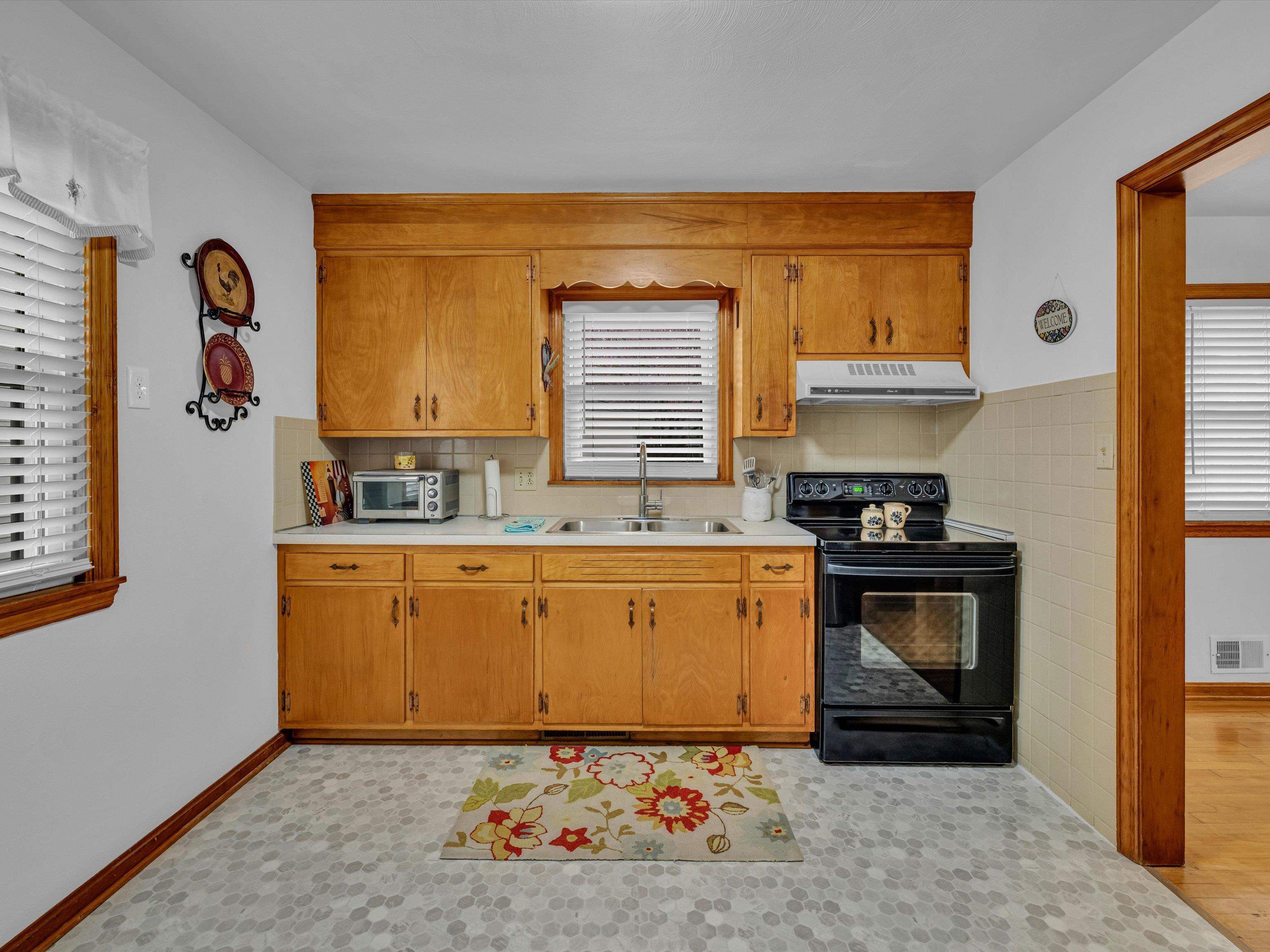 Window above Kitchen Sink that looks into the backyard.