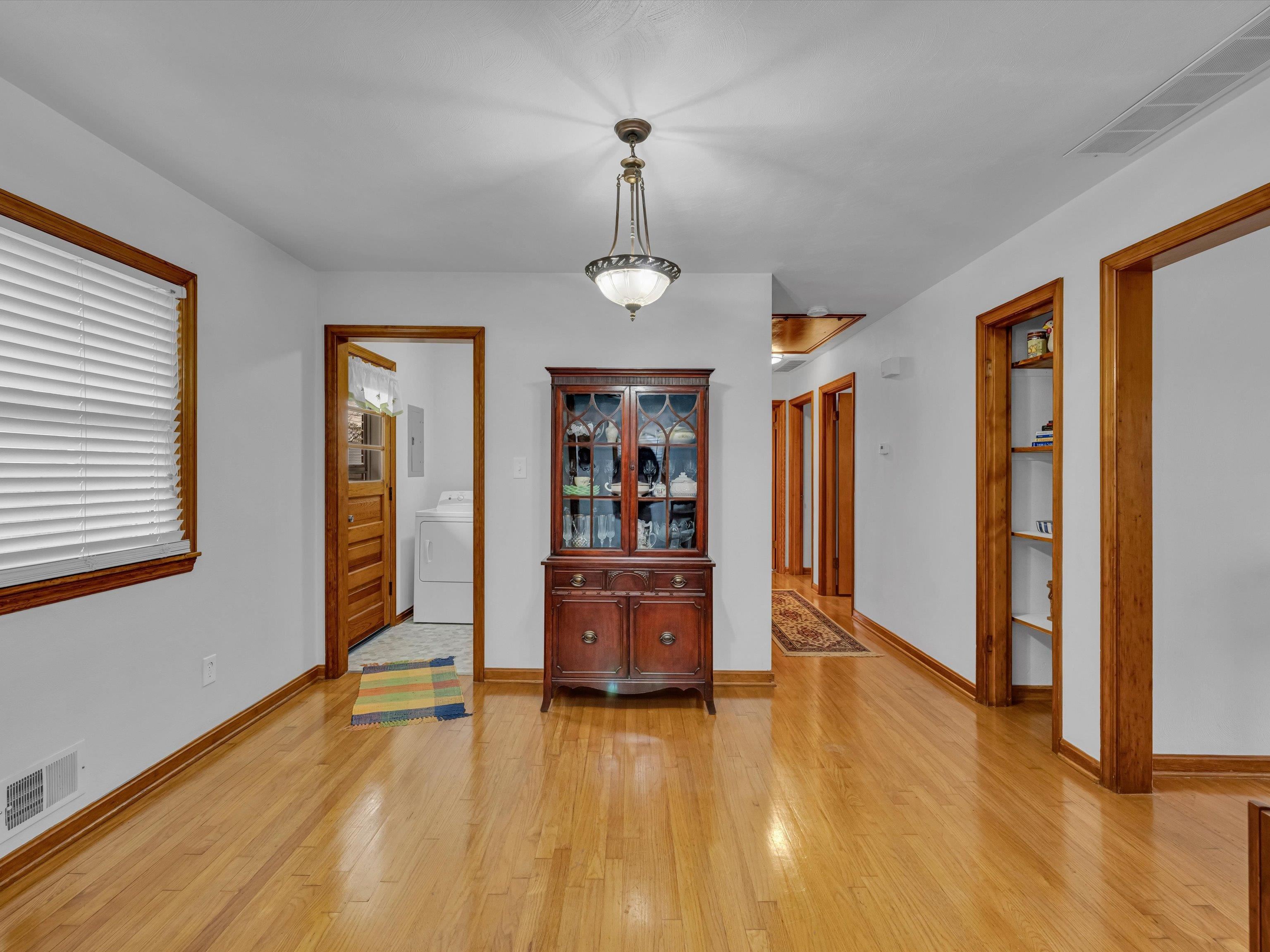 View to the left; laundry room & exterior back door. View to the right, toward the bath & Bedrooms.