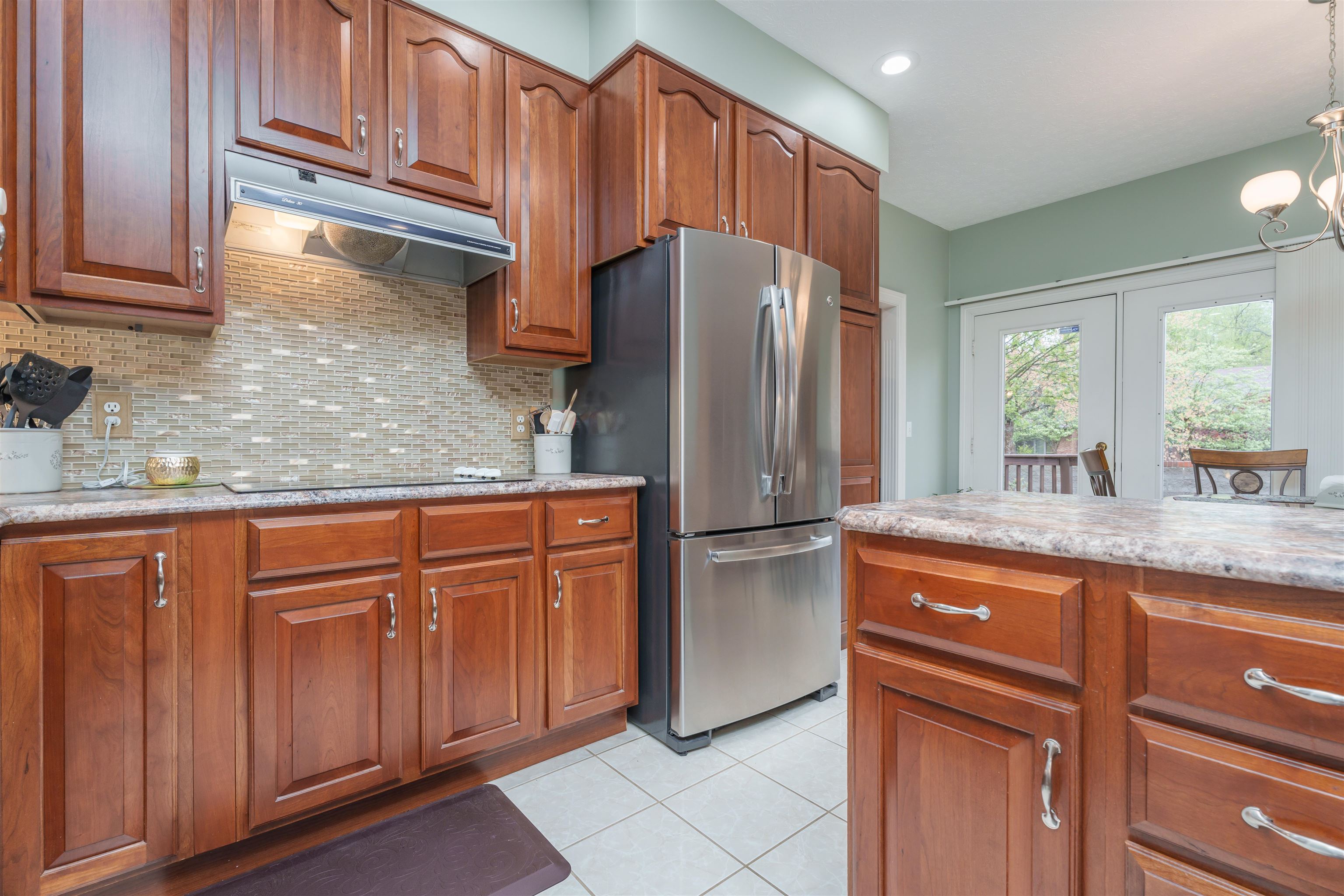 New countertops, new backsplash, newer refrigerator, range & dishwasher.