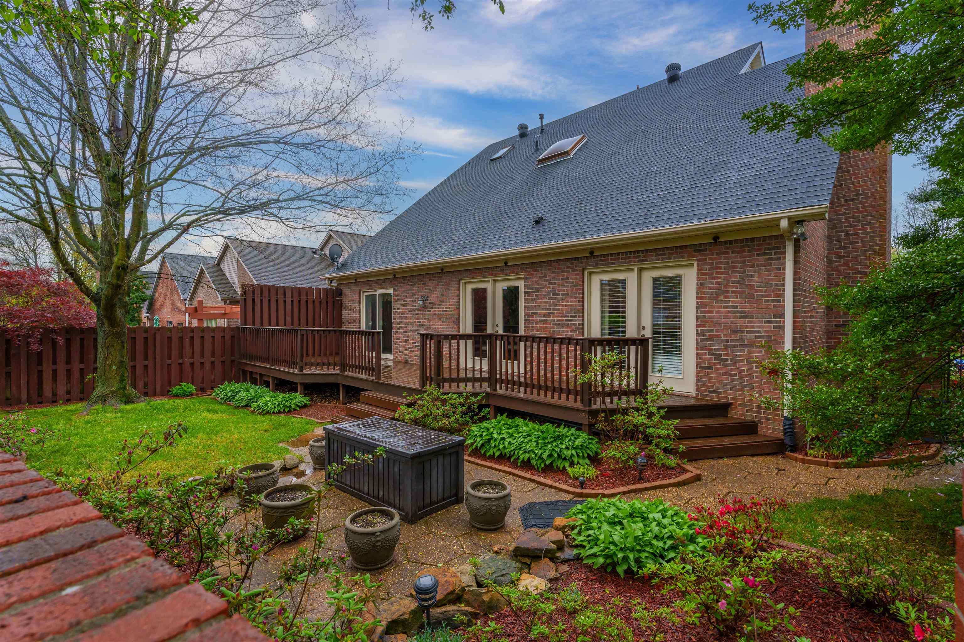 3 back patio doors: one leading out from the living room, the kitchen, & the master suite.