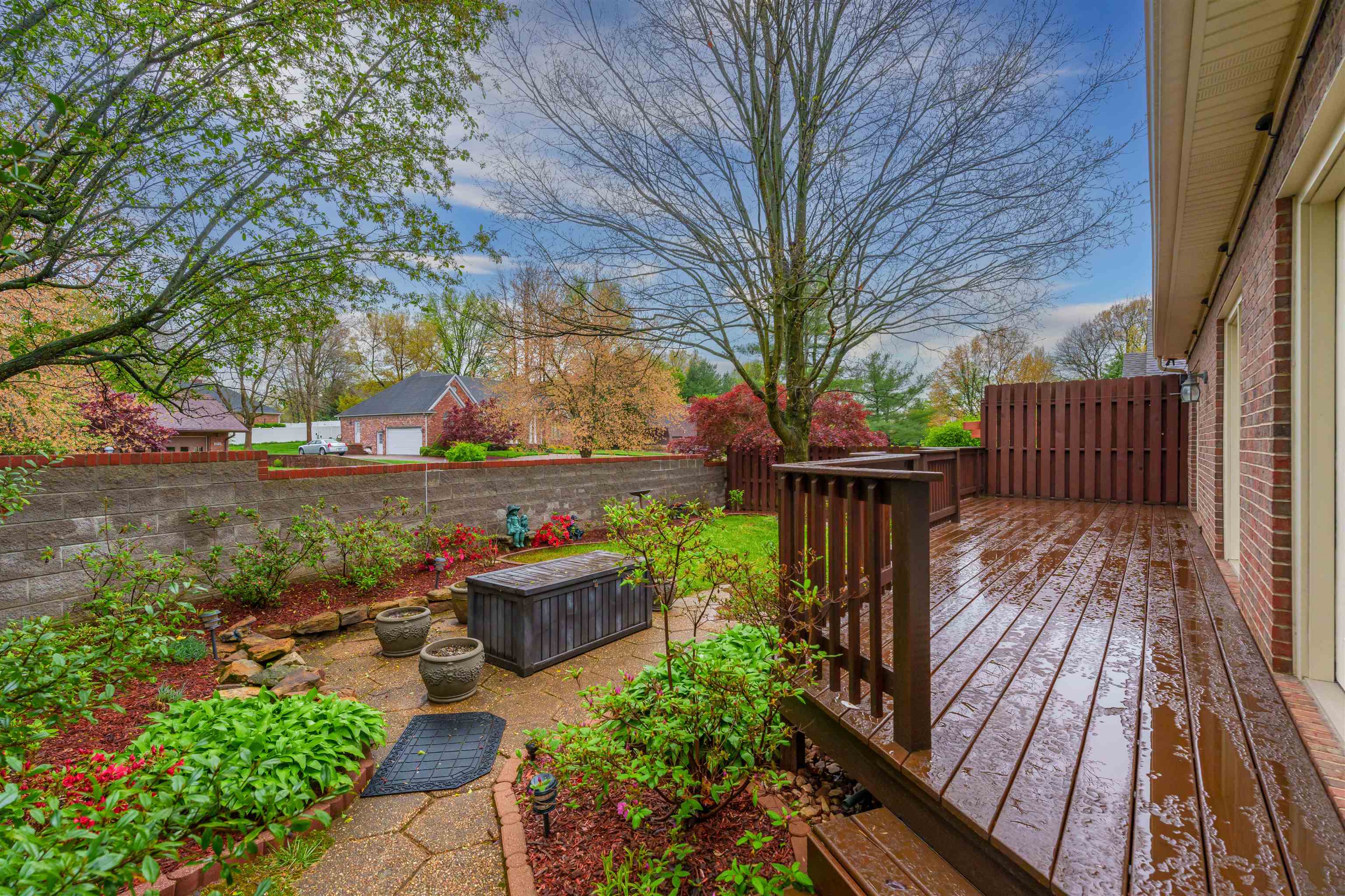 Private backyard with new patio that's been recently painted & sealed.