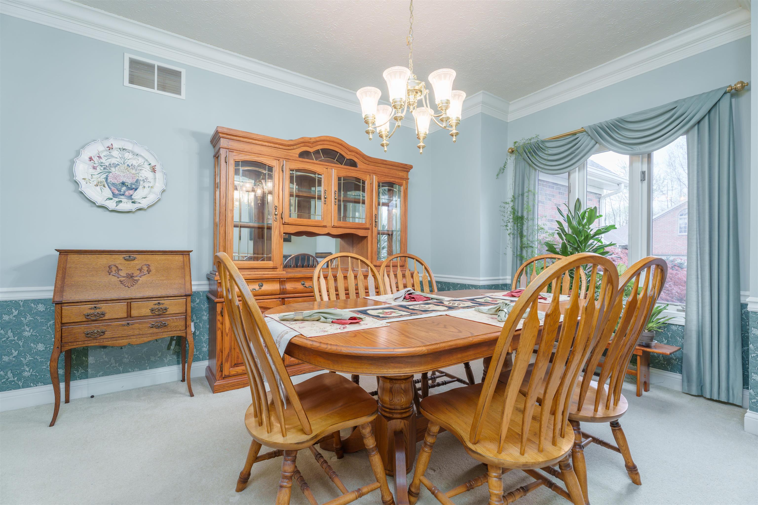 Formal dining room with beautiful crown molding.