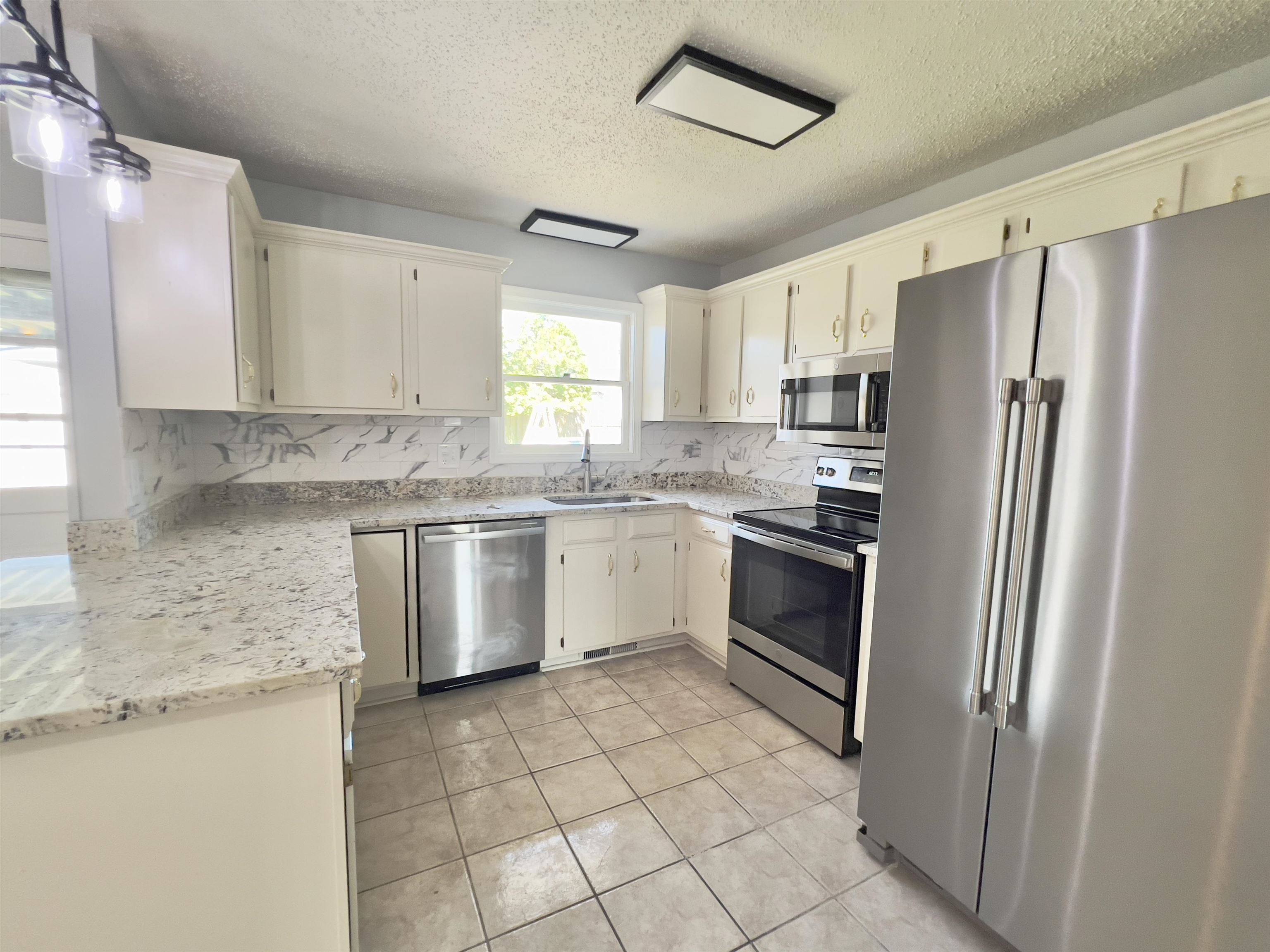 All new stainless steel appliances and granite countertops