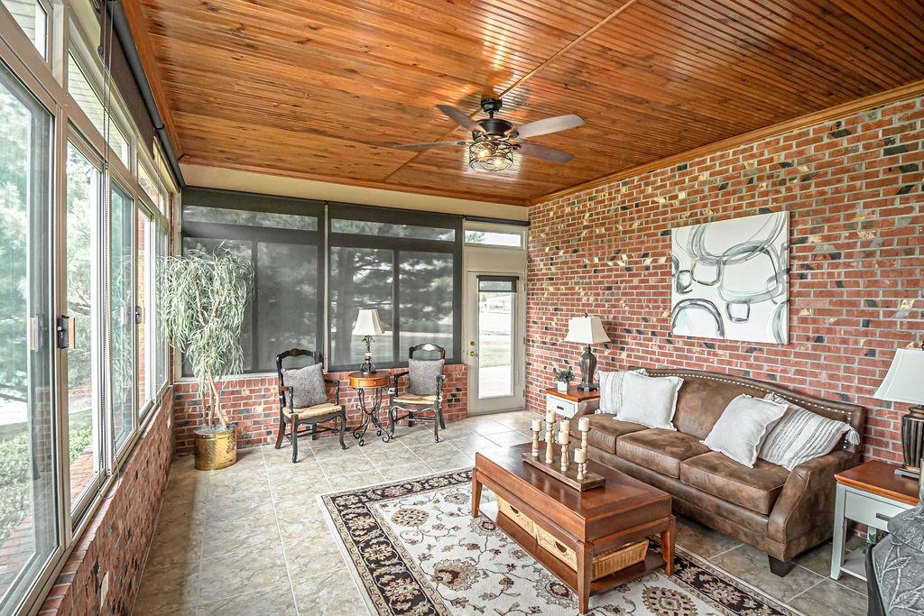 You'll love relaxing in the cozy sun room!