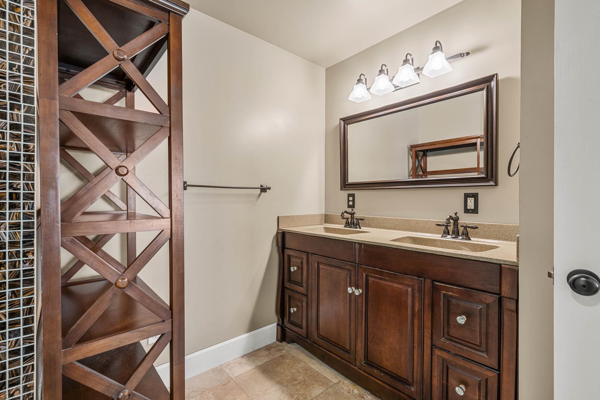 Double bowl vanity, extra deep and long tub with tiled surround.  Walk-in closet.