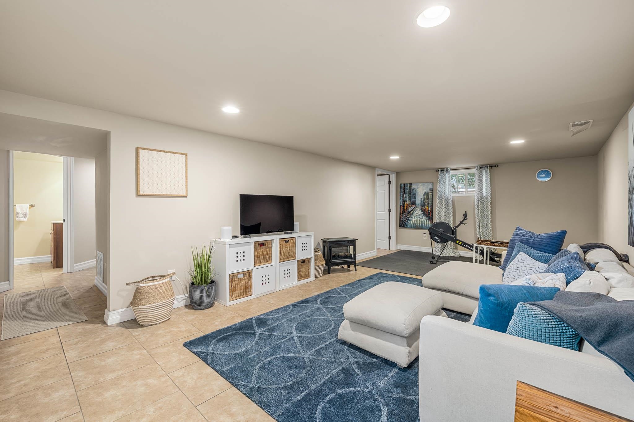Includes living area, sizable bedroom, full bath w/walk-in shower, laundry/utility room, storage