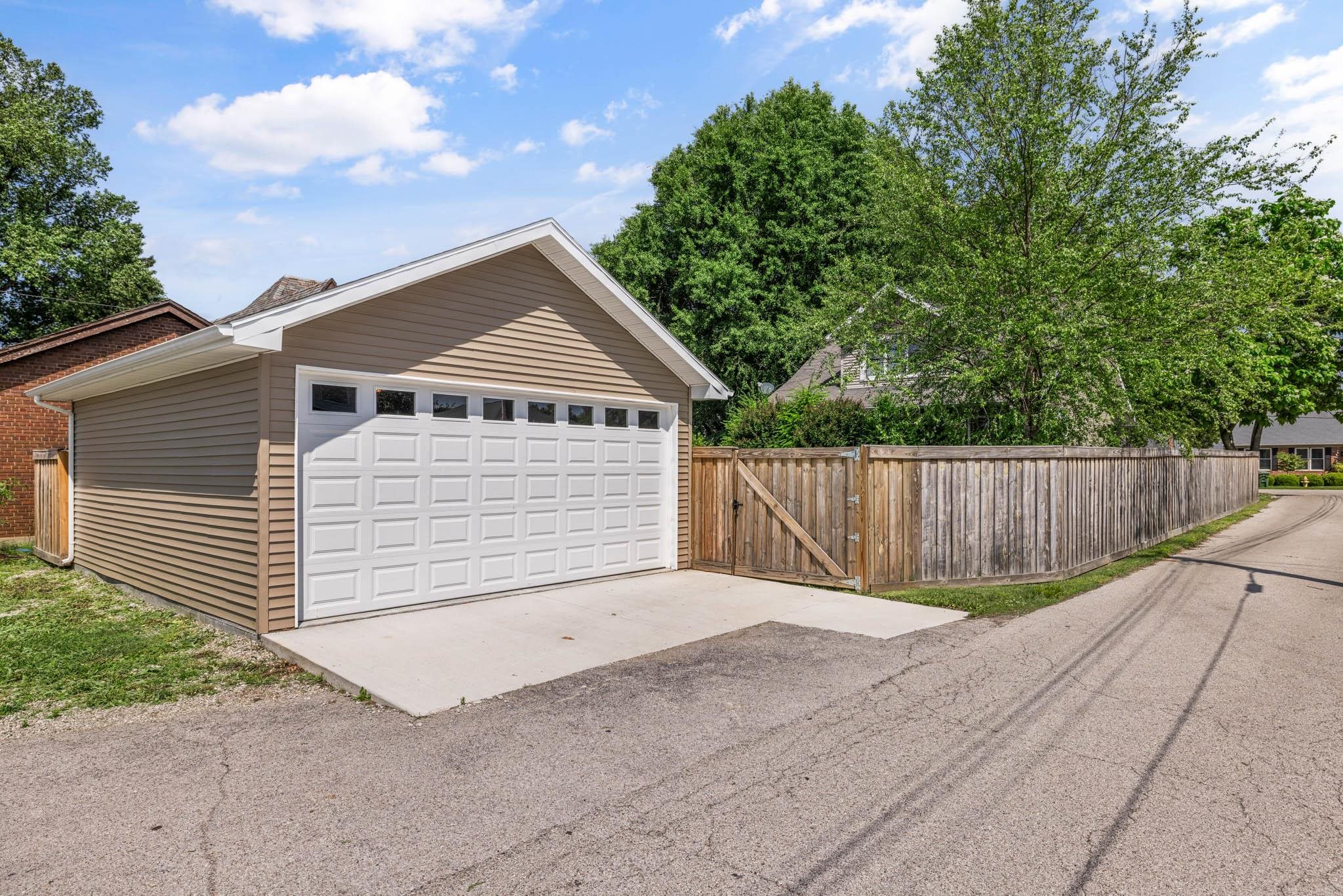 Private and secure entrance and exit from back lawn.  Garage door opener.